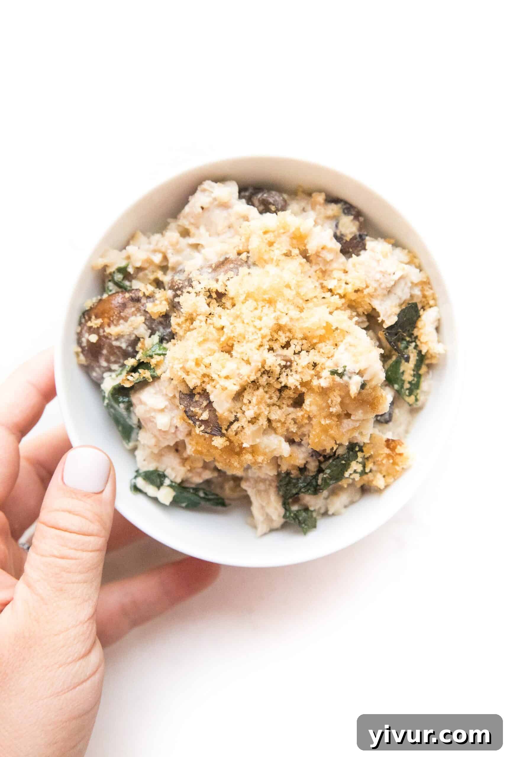 Savory Whole30 Keto Creamy Chicken Cauliflower Bake 4 creamy chicken and kale casserole in a bowl, ready to be enjoyed