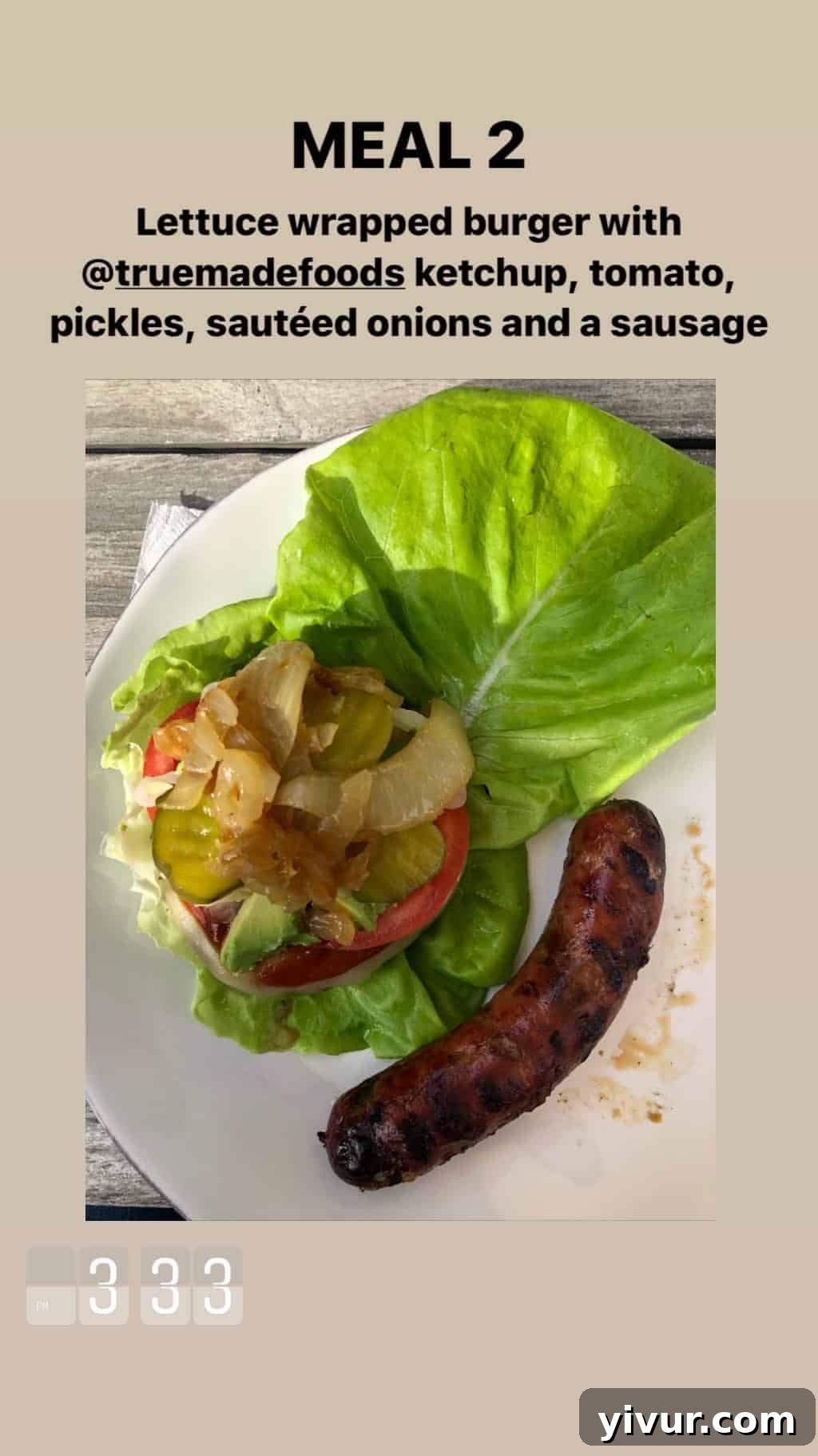 My October Clean Keto Whole30 Food Diary 2019 69 A lettuce-wrapped burger topped with tomato, pickles, sauteed onions, and sausage.