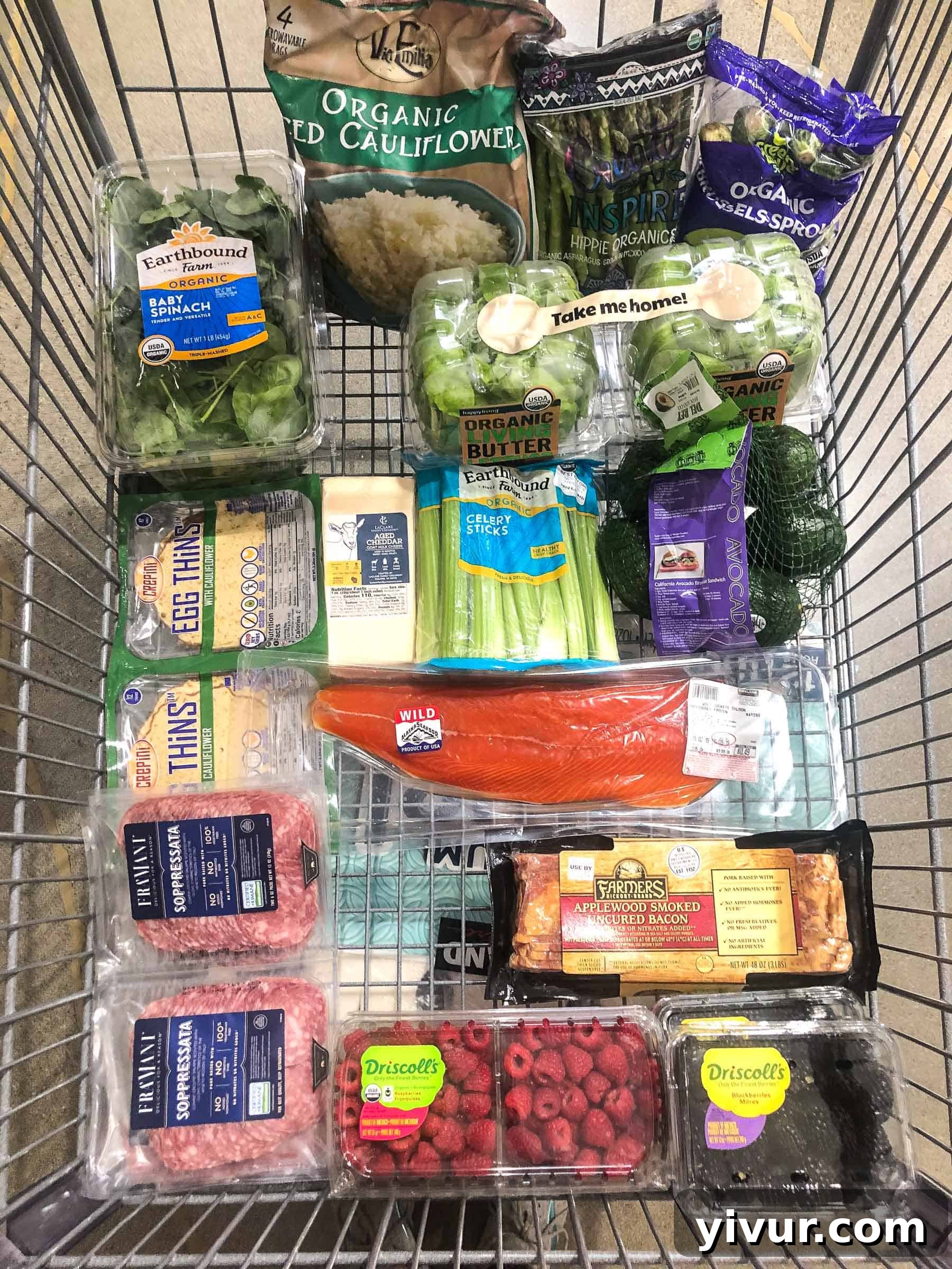 Costco grocery haul showcasing bulk Whole30 and Keto compliant items like olive oil, nuts, and organic produce.