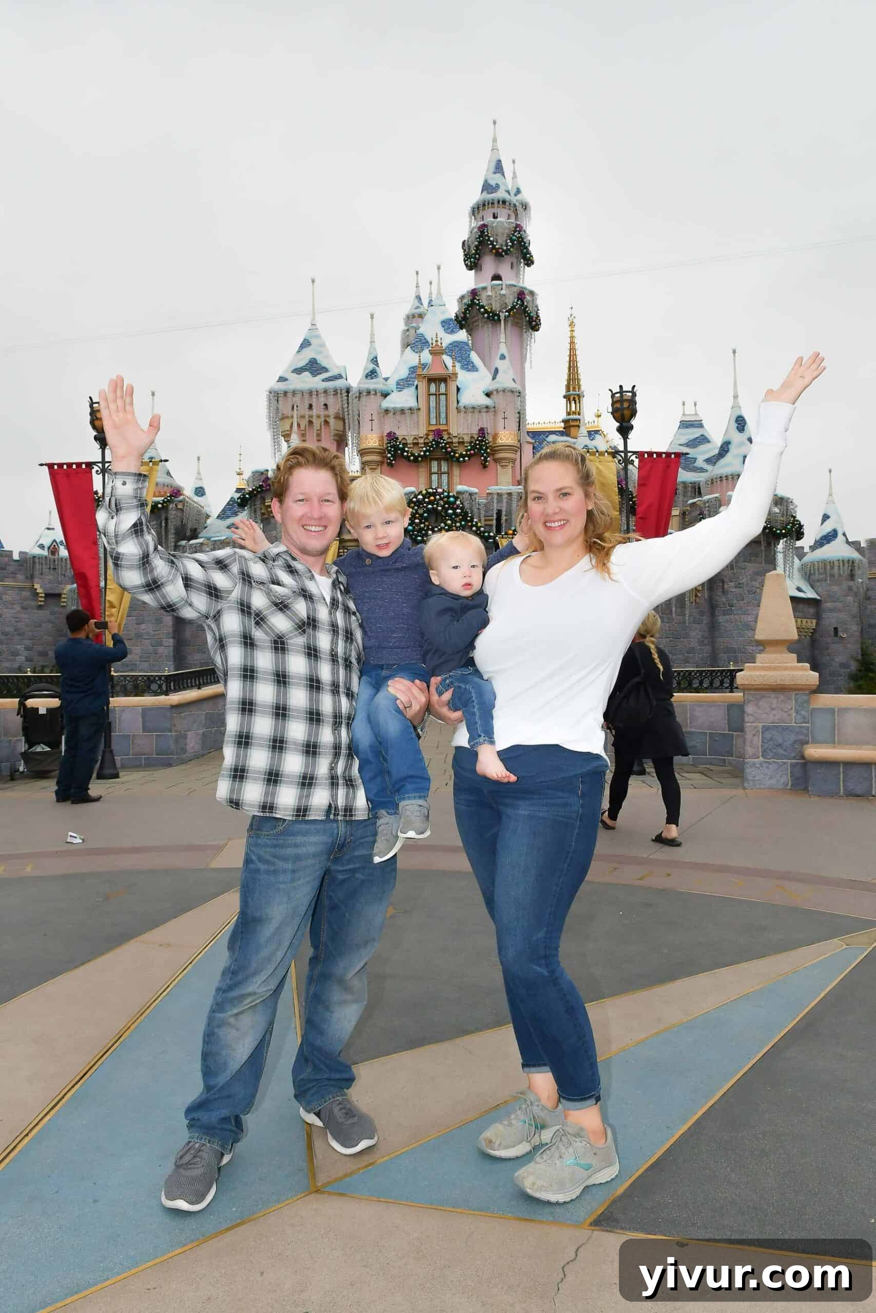 Family enjoying Disneyland with toddlers