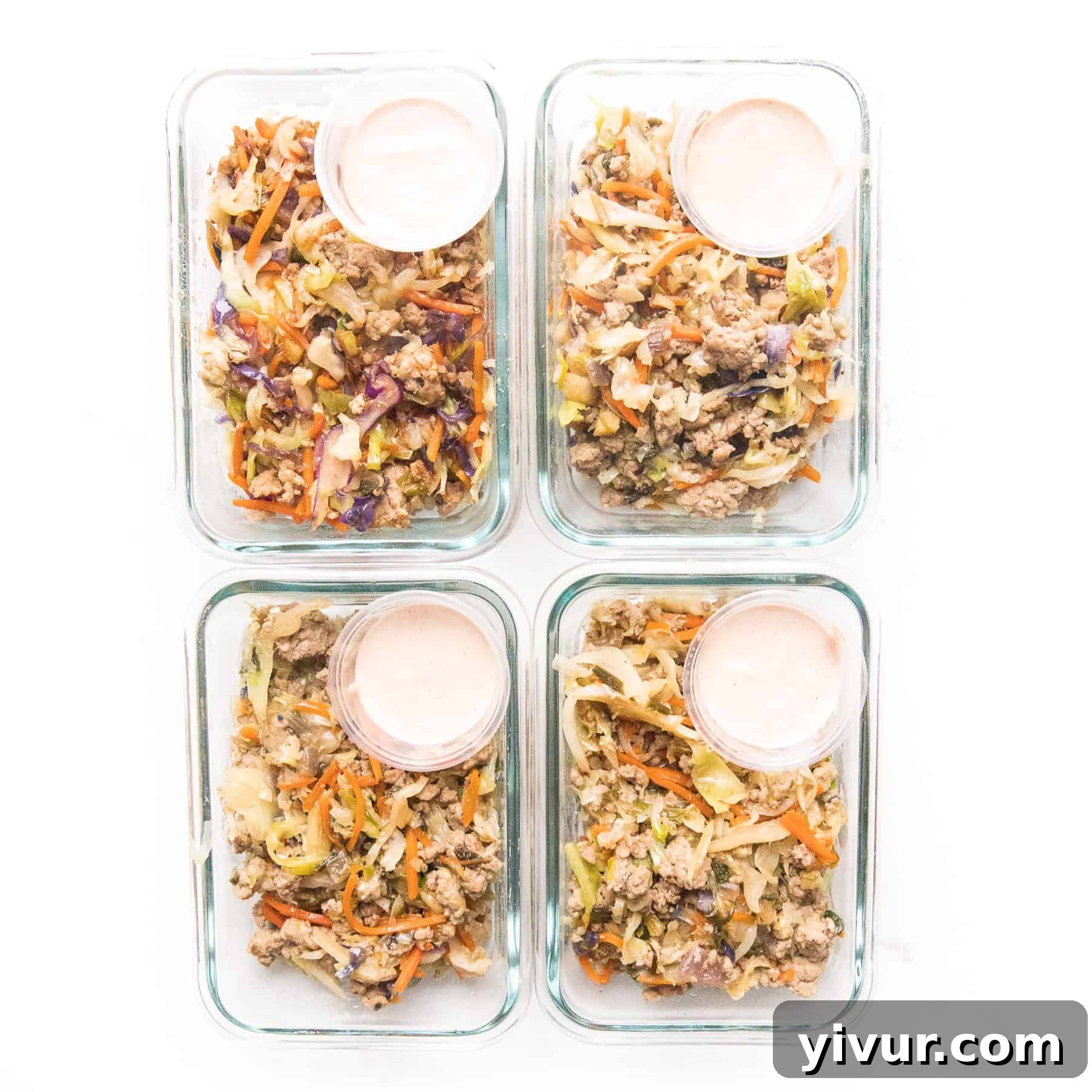 Glass meal prep containers filled with Whole30 Keto Mu Shu Pork, ready for the week