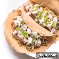 MU SHU PORK IN CAULIFLOWER WRAPS TOPPED WITH SRIRACHA MAYO