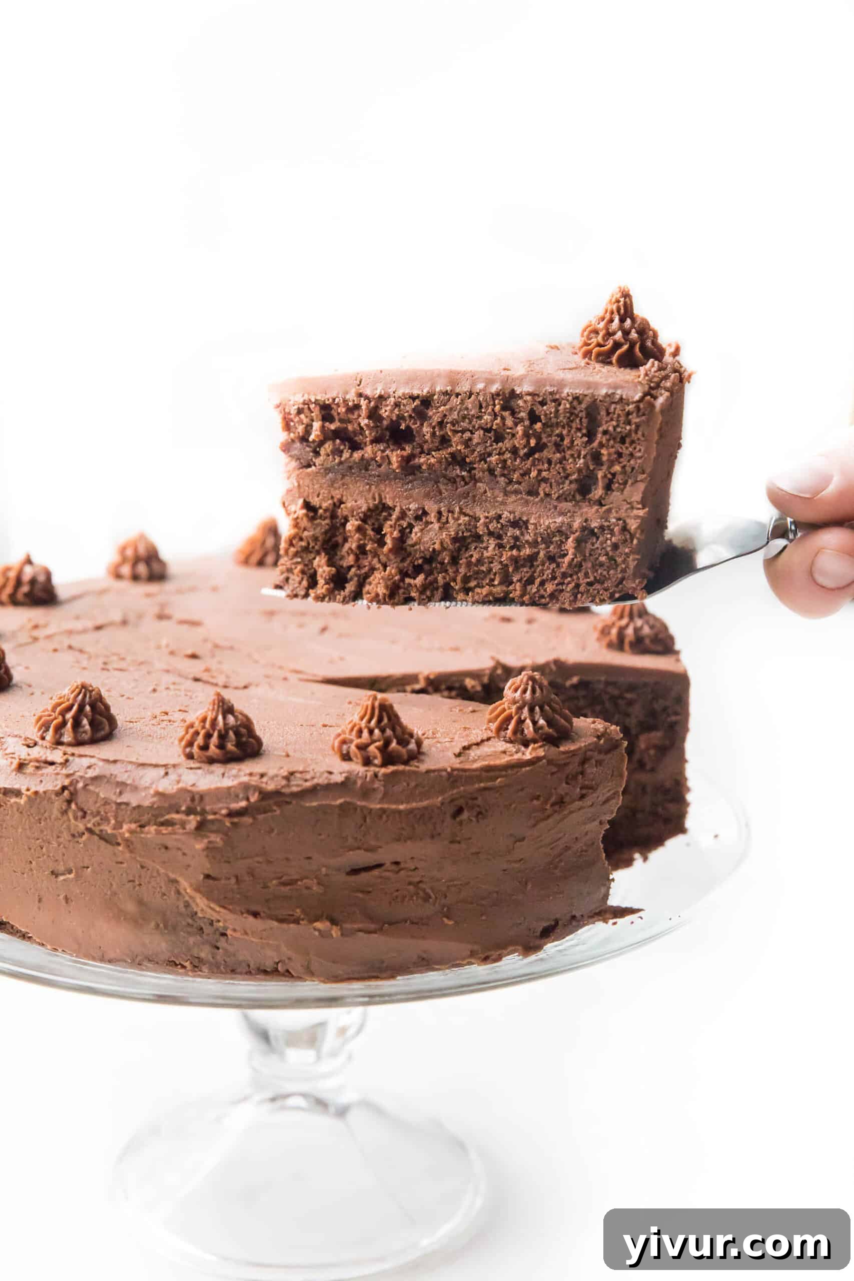 Creamy Keto Dairy Free Mint Chocolate Frosting 4 Lifting a slice of chocolate cake