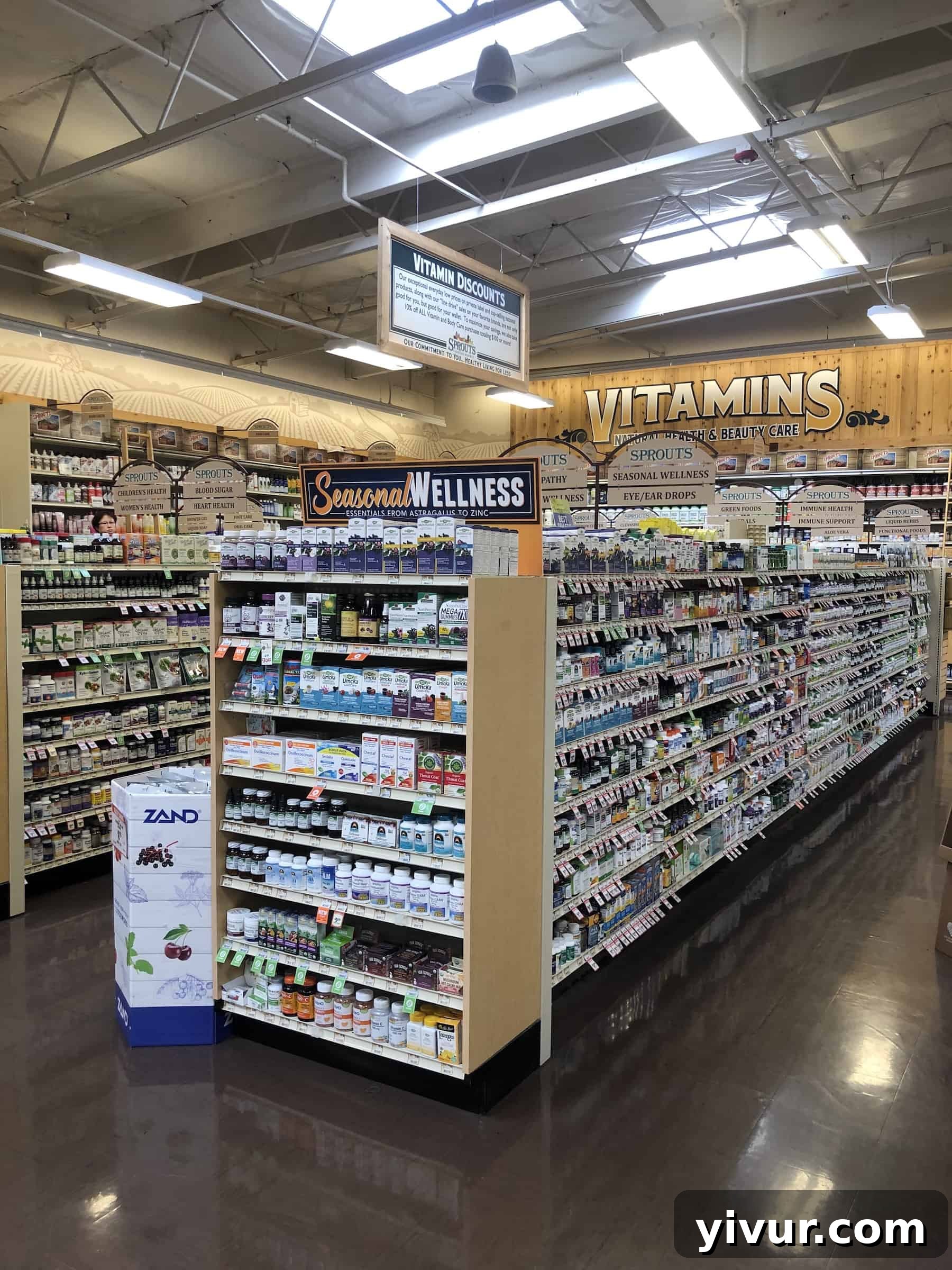 A well-organized display of vitamins, supplements, and natural body care products at Sprouts.
