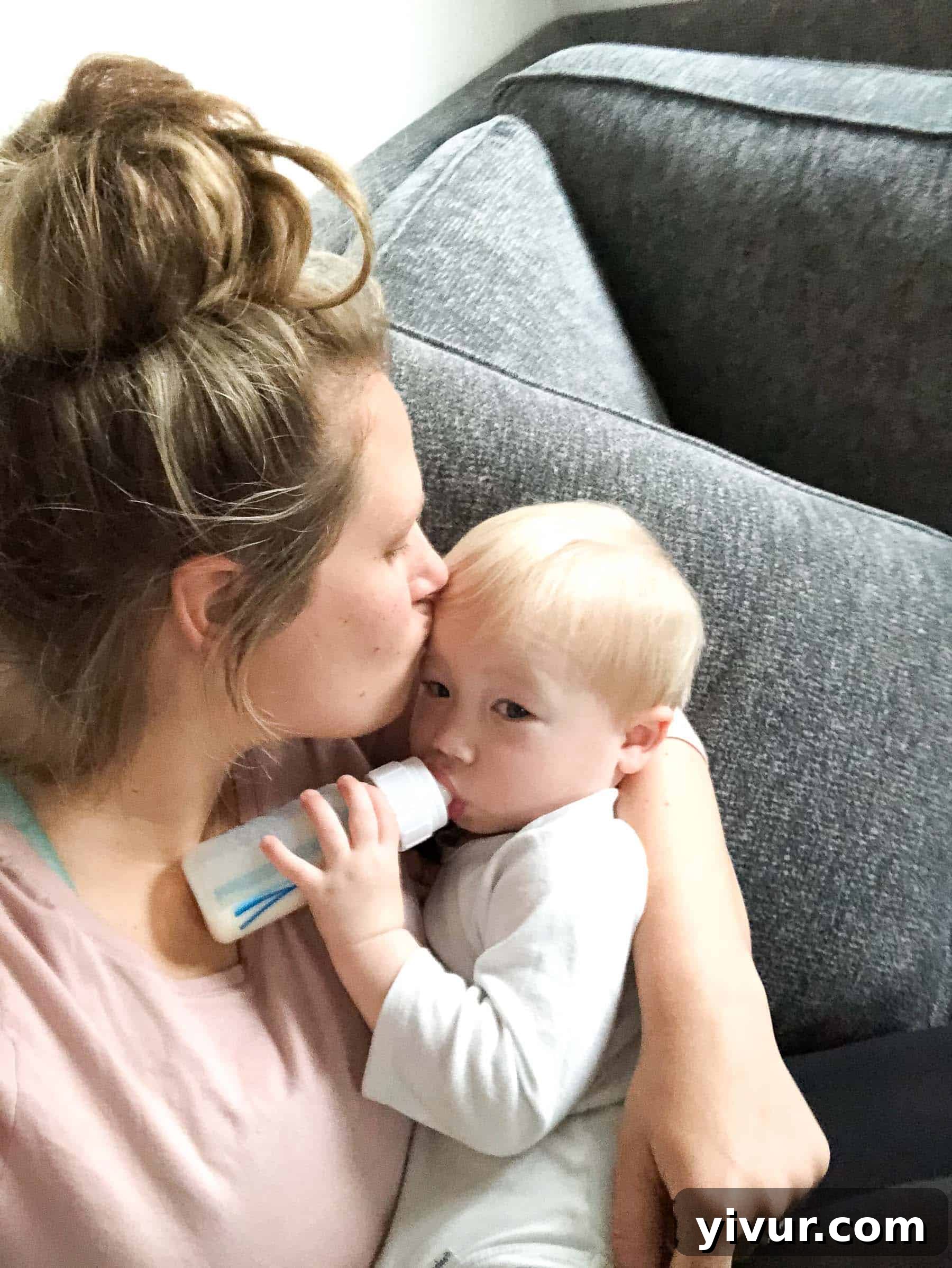 A mother holding her baby, symbolizing the end of a breastfeeding journey.