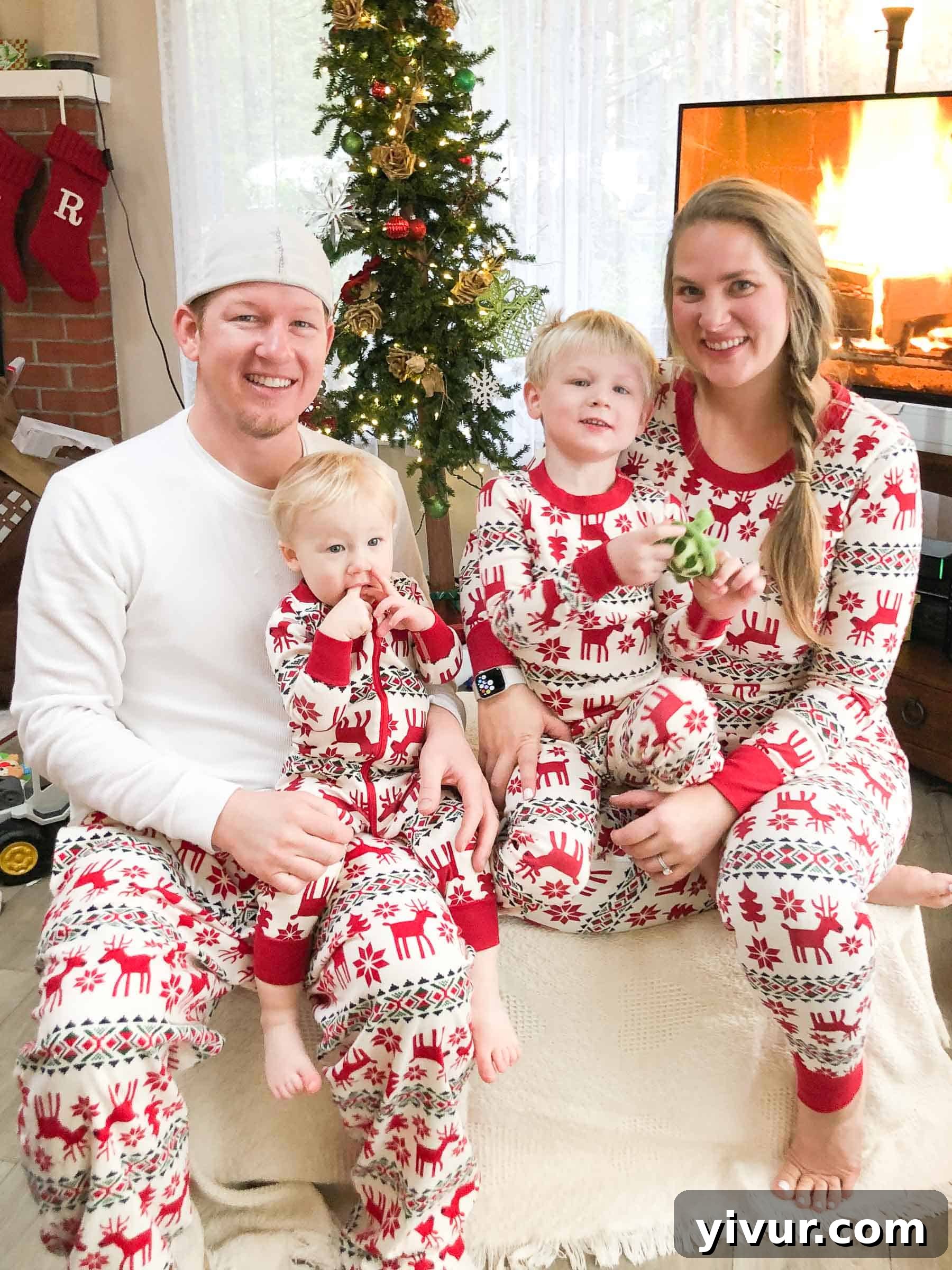 Children playing joyfully in fresh snow outside a cozy cabin, celebrating a snowy Christmas.
