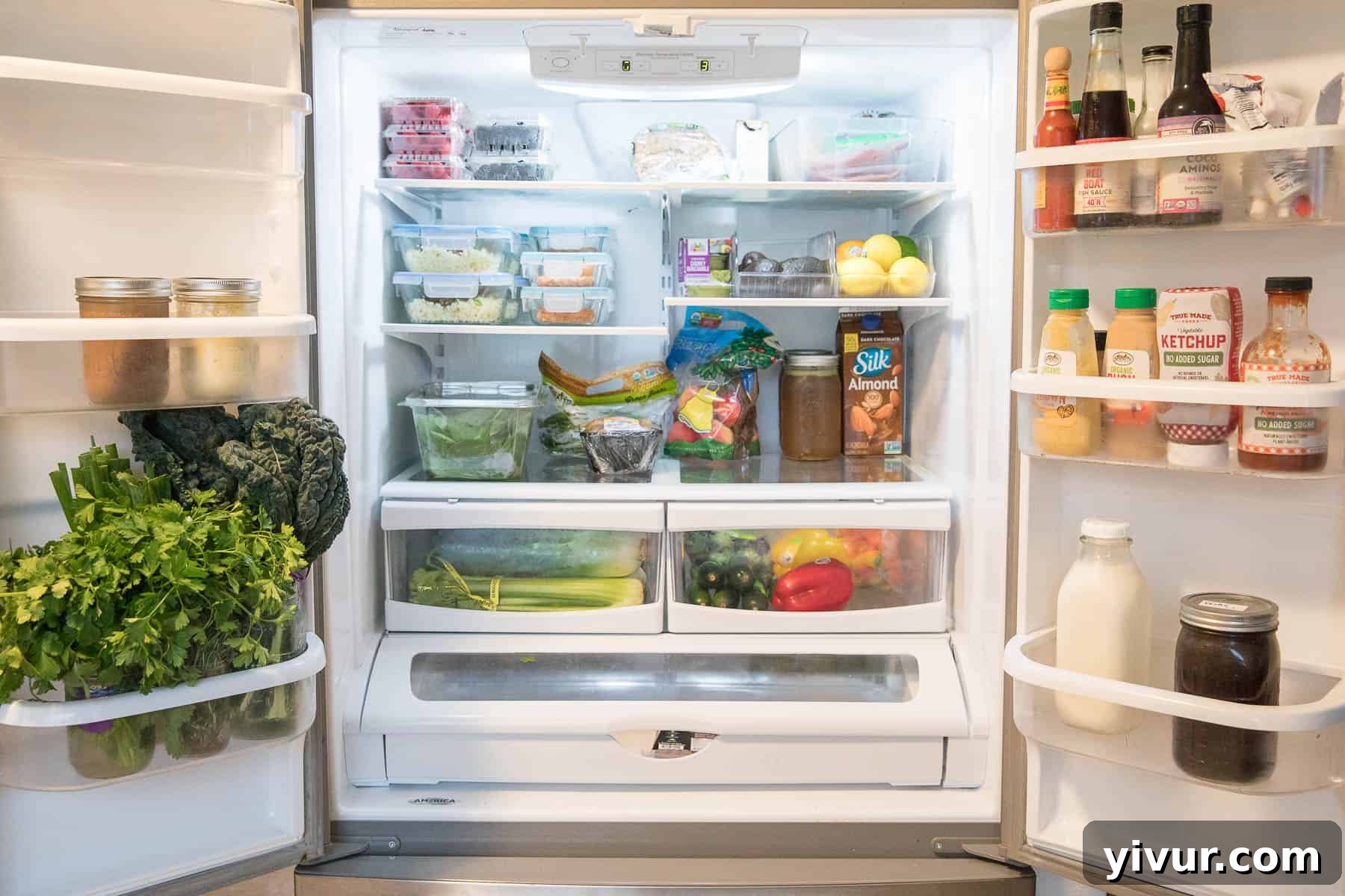 Organized keto refrigerator with produce, meal prep, condiments