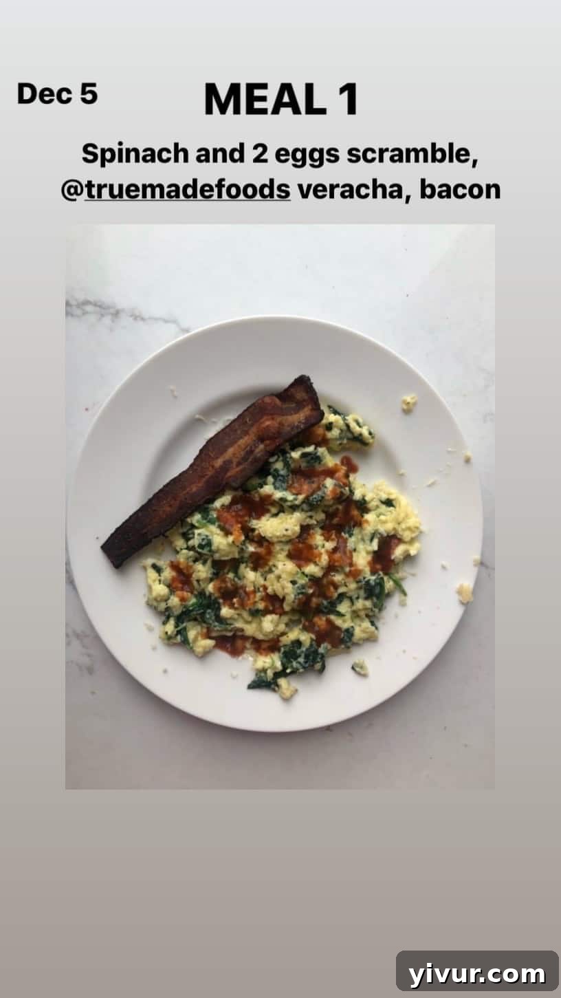 December 2019 Clean Keto and Whole30 Food Diary 16 A simple yet satisfying spinach and egg scramble with True Made Foods Veracha and crispy bacon, a go-to keto breakfast.