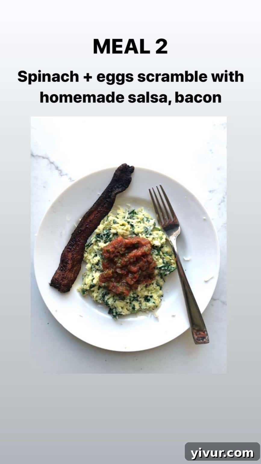 December 2019 Clean Keto and Whole30 Food Diary 8 A close-up of a spinach and egg scramble, enhanced with fresh homemade salsa and a side of crispy bacon, a savory keto breakfast.