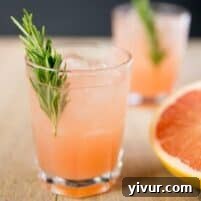 A delicious Rosemary Greyhound Cocktail with fresh grapefruit and rosemary.