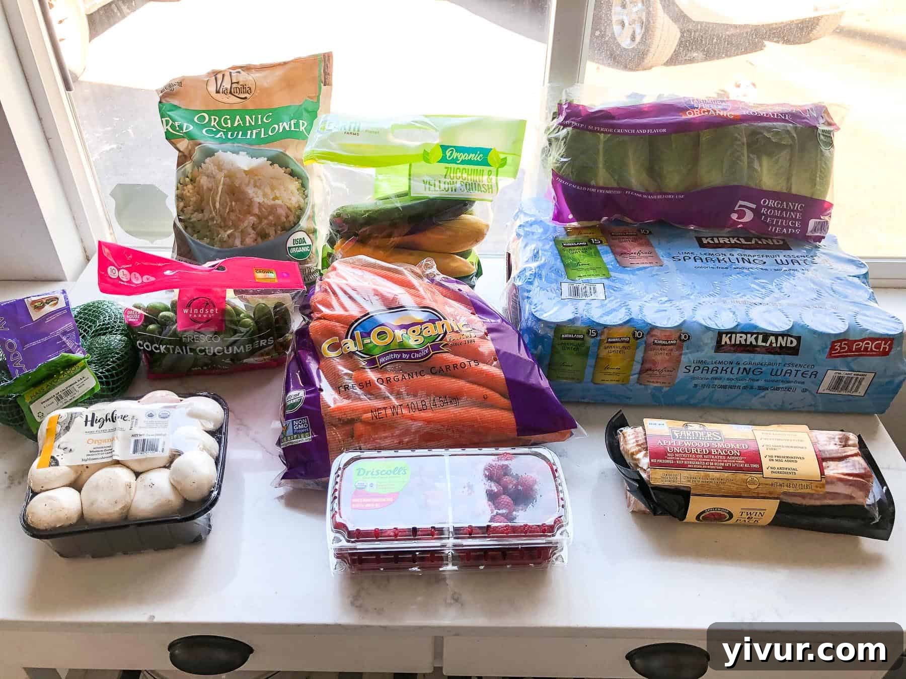 A snapshot of a typical Costco Whole30 and Keto grocery haul, featuring bulk compliant items like produce and pantry staples.