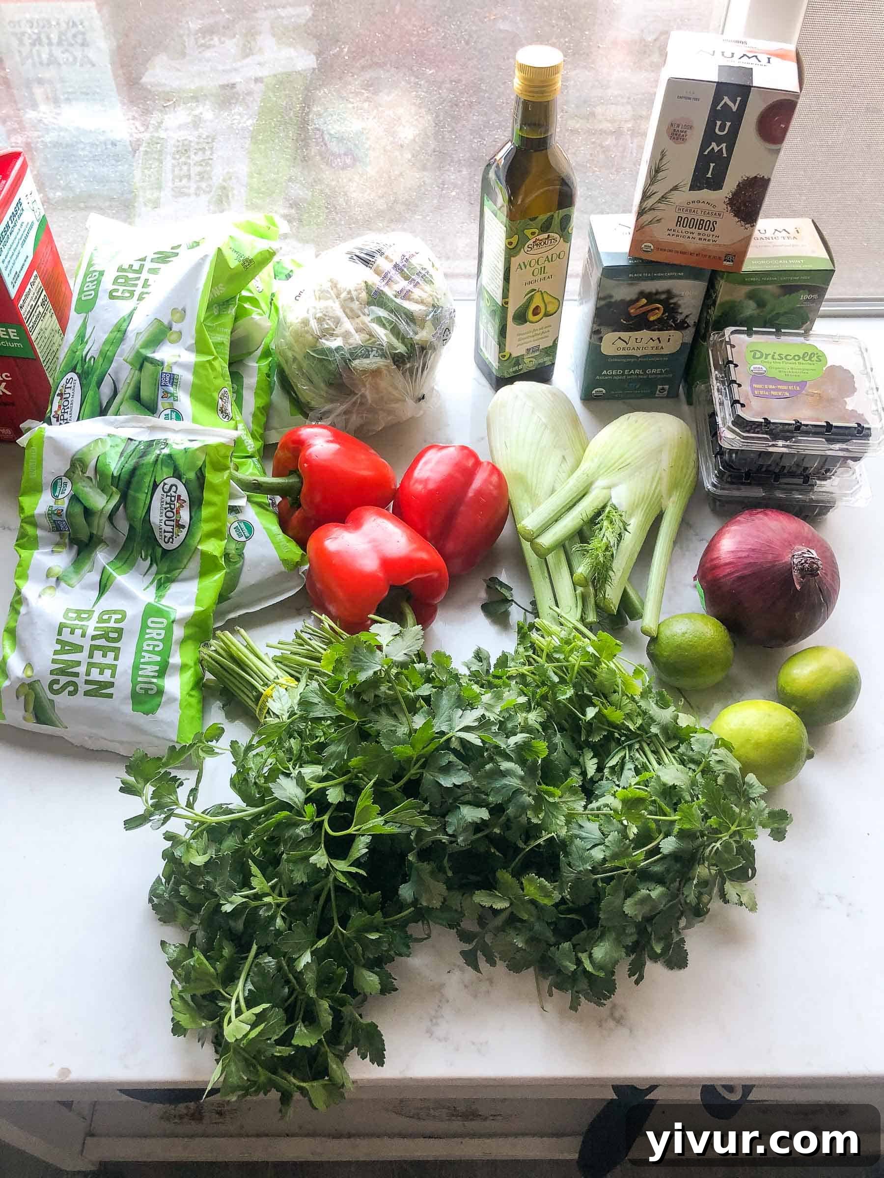 A comprehensive Sprouts Whole30 and Keto grocery haul, showcasing fresh organic produce, herbs, and specialty items.
