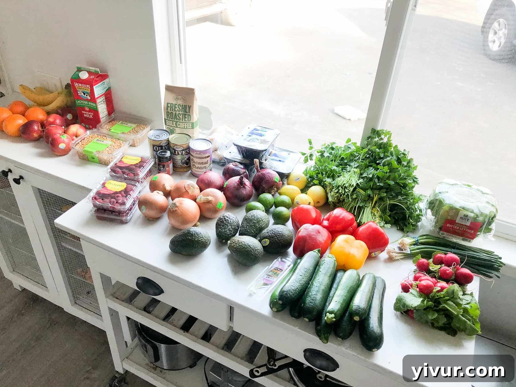 A selection of fresh produce, organic vegetables, and Whole30 Keto compliant groceries from Sprouts, ready for meal prep.