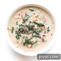 whole30 + keto zuppa toscana soup in a white bowl on a white background