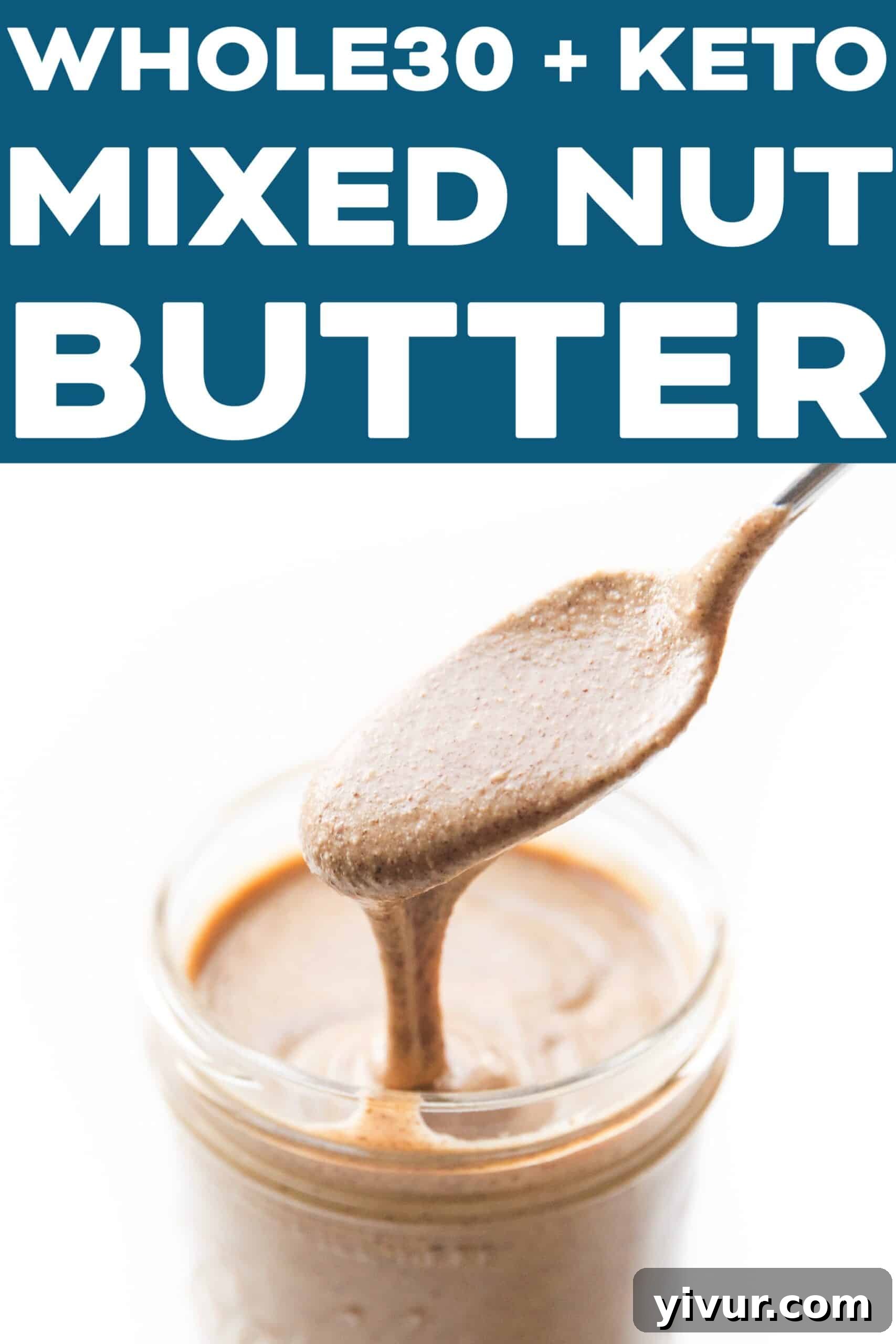 Close-up of freshly made mixed nut butter in a mason jar, with a spoon taking a scoop.