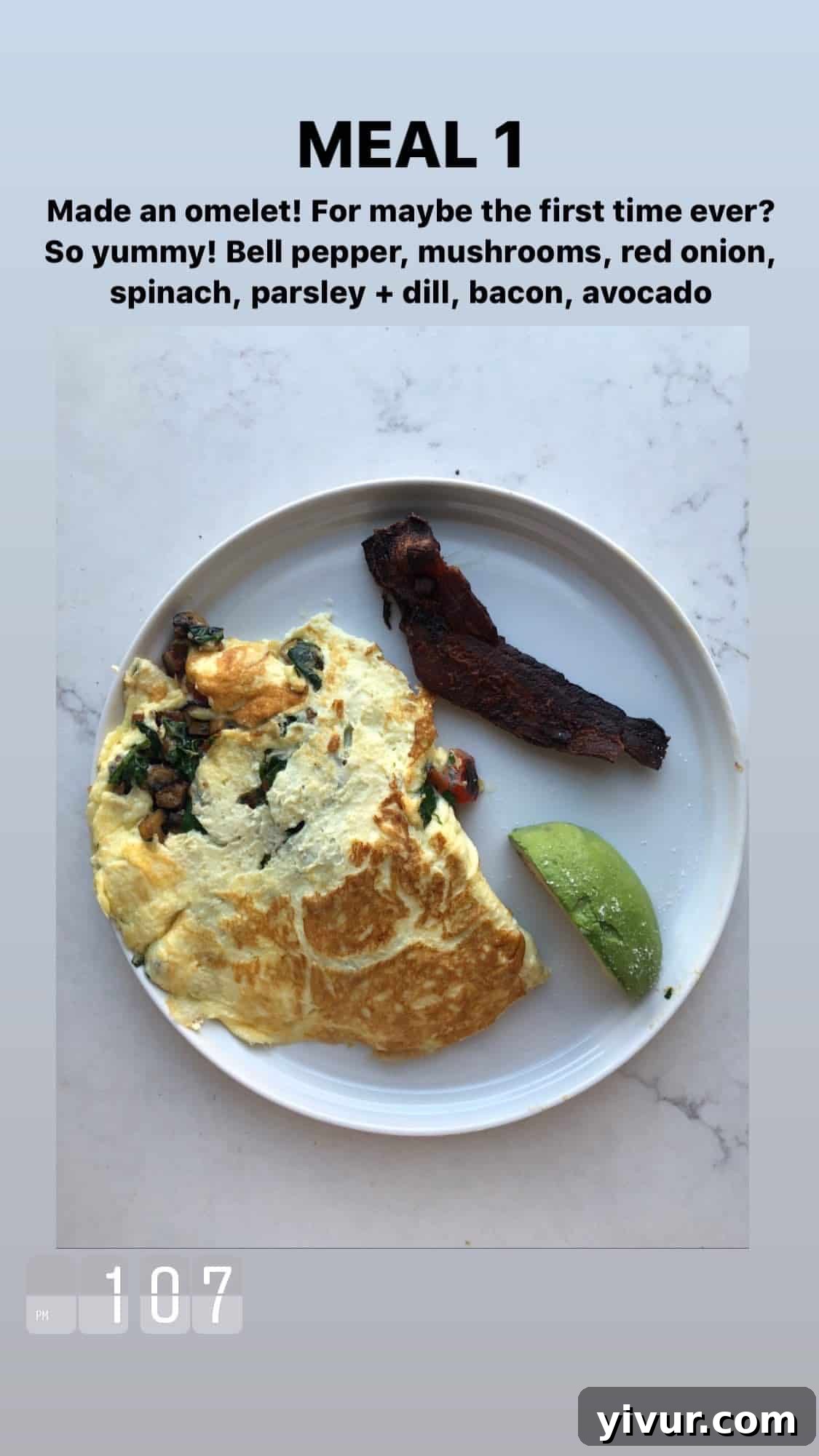 Omelet with bell peppers, mushrooms, red onion, spinach, parsley, dill, bacon, and avocado - a veggie-loaded keto breakfast