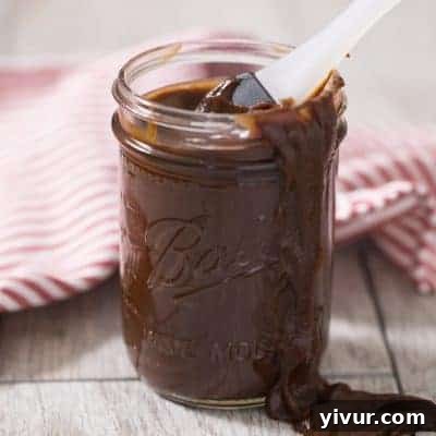 A jar of homemade Whole30 and Keto BBQ Sauce, rich and sugar-free.