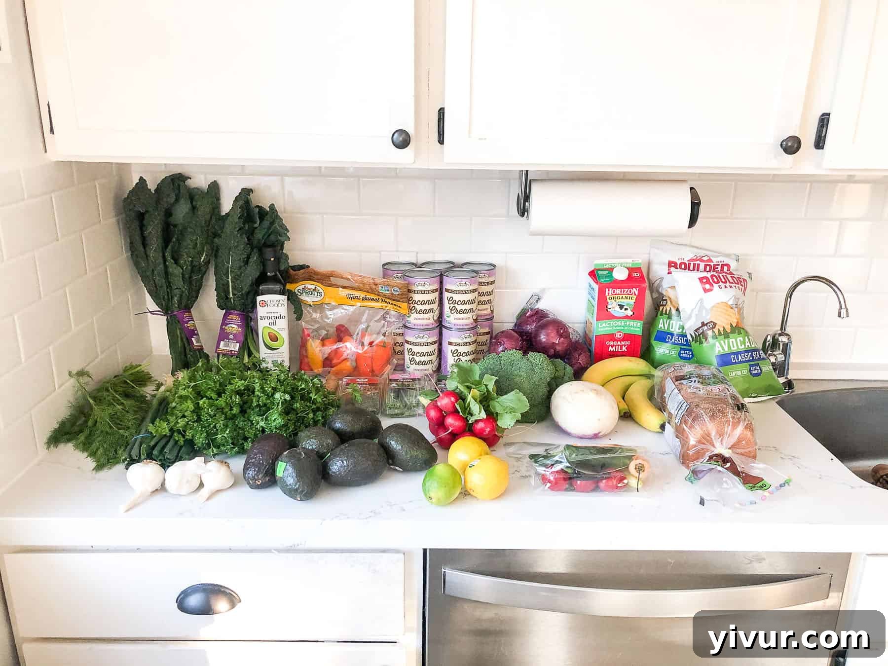 A grocery haul from Sprouts, showcasing fresh, organic produce, specialty Whole30 and Keto friendly ingredients, and a variety of colorful vegetables.