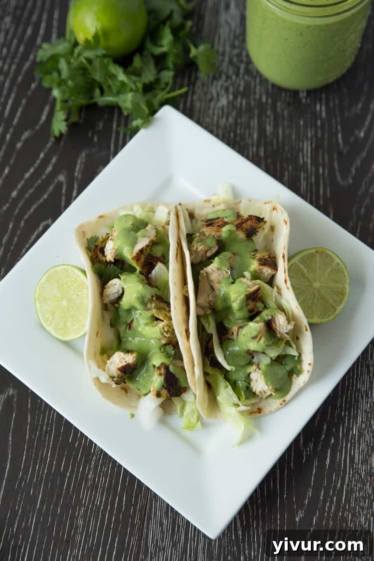 A close-up shot of a single chicken taco, highlighting its fresh ingredients and inviting appeal