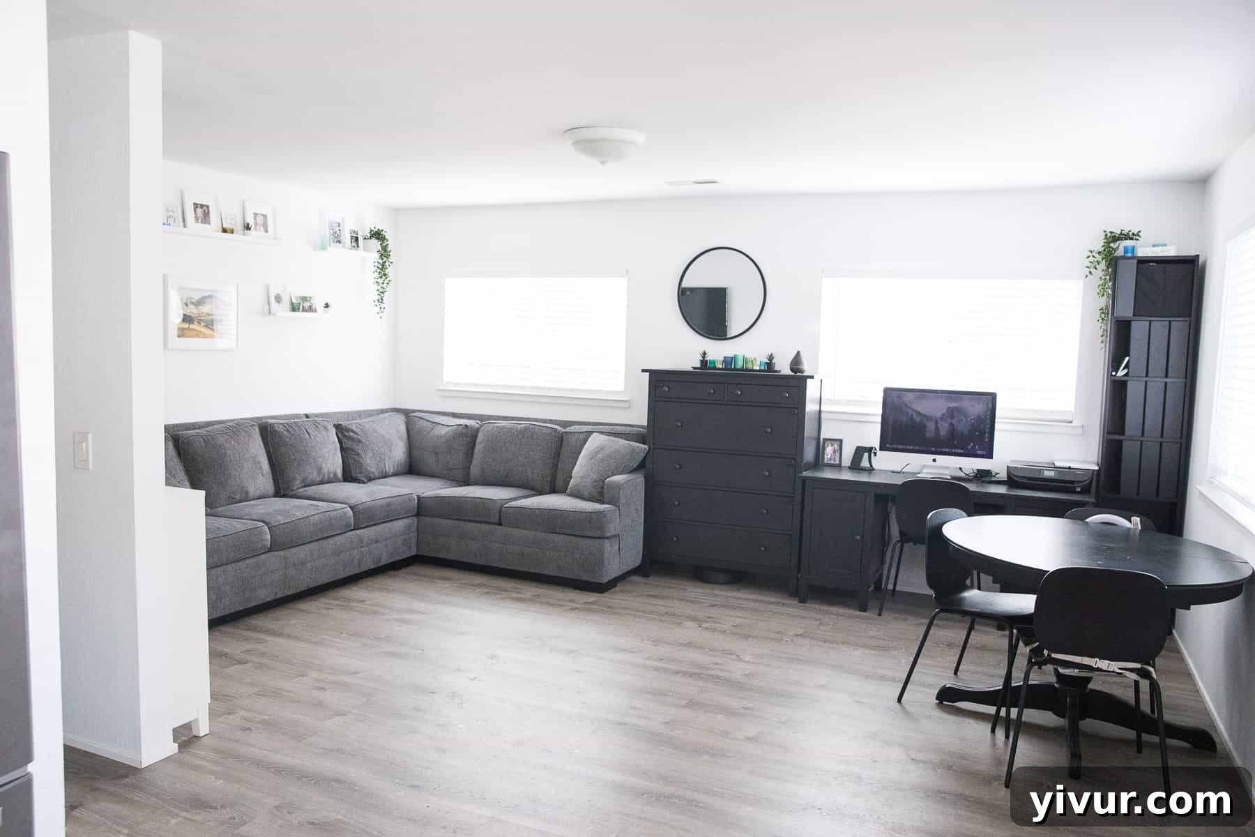 Step Inside Our 700 Sq Ft Tiny Home 3 Bright tiny home living room with a comfortable couch, tall dresser, and decor