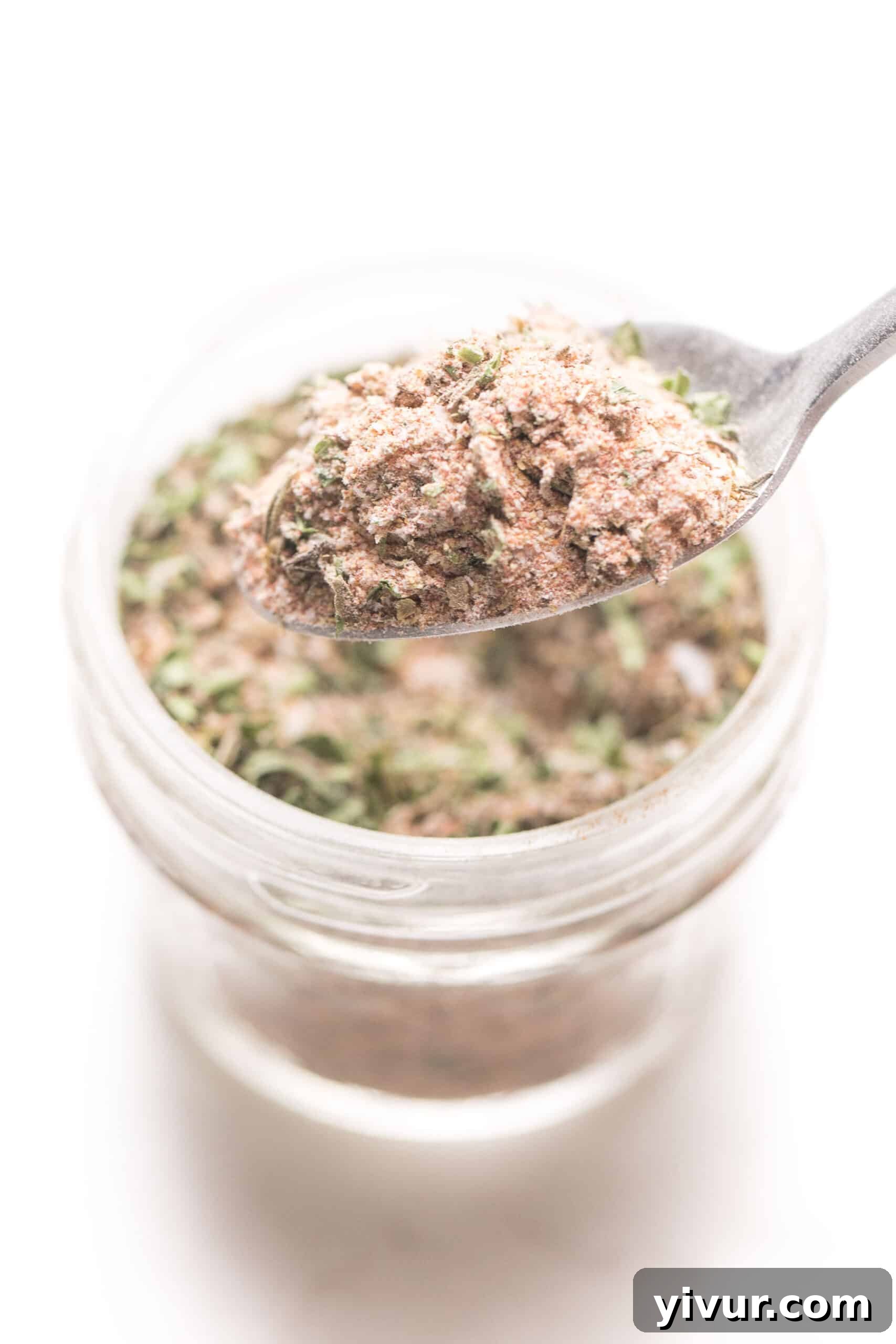 A mason jar filled with easy, non-spicy homemade blackened seasoning for Whole30 and Keto diets.
