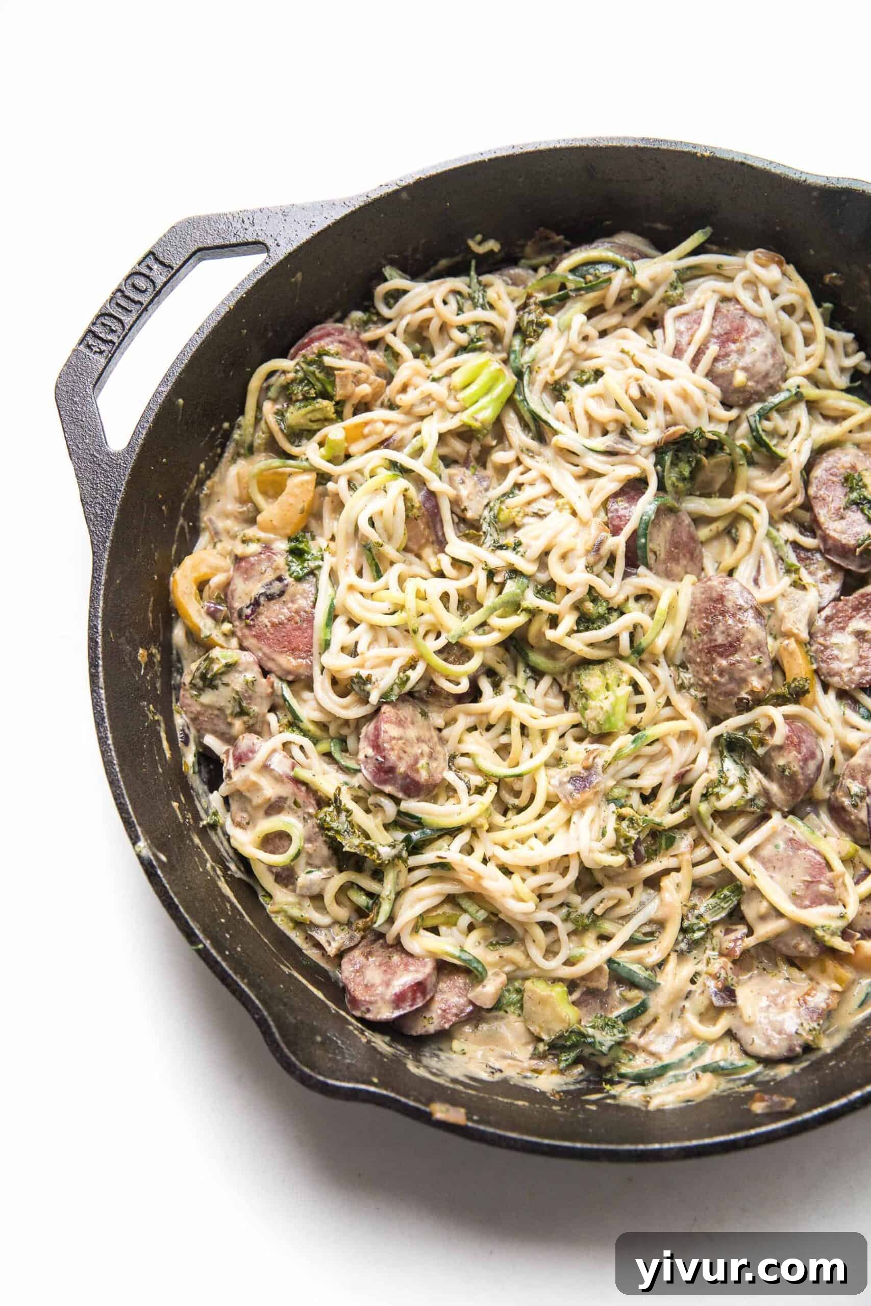 creamy pasta bubbling gently in a cast iron skillet, showcasing its rich texture