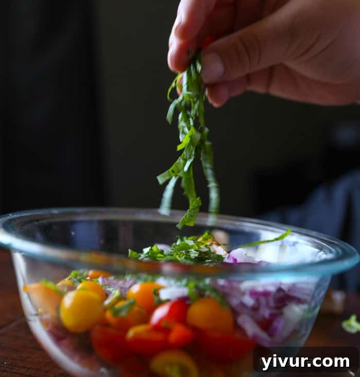 Bruschetta-8: Mixed tomatoes, onions, and basil in a bowl