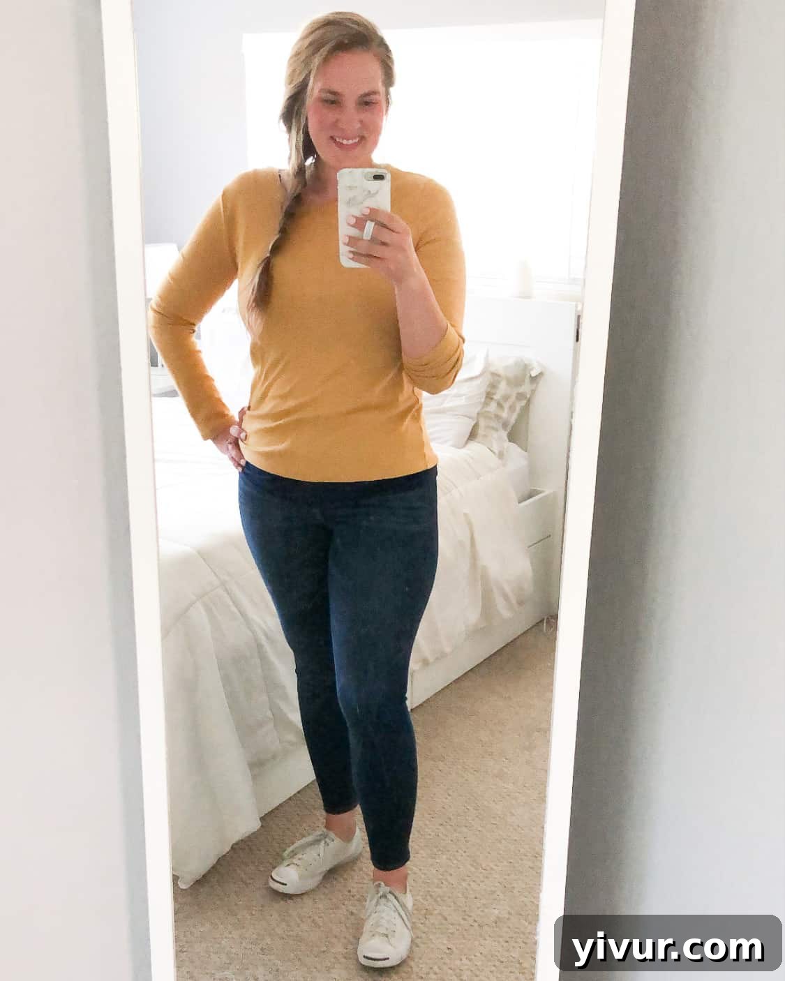 Curvy woman modeling additional fashion basics, including high-waisted jeggings, a fitted tank top, and classic white sneakers, showcasing practical and chic everyday attire.