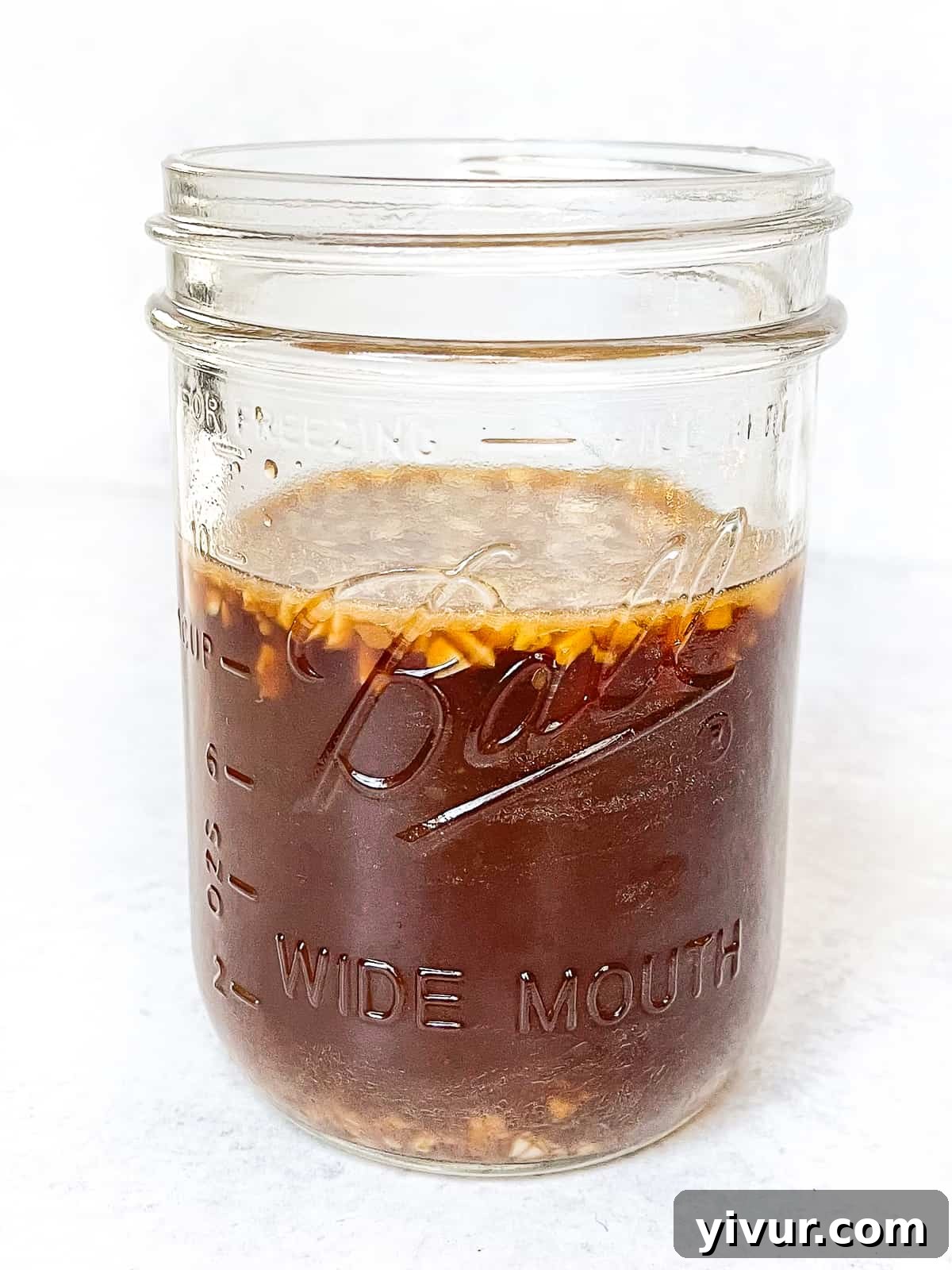 glossy homemade stir fry sauce in a mason jar