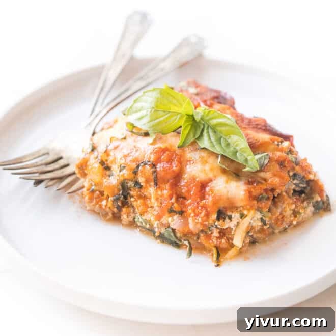 Rich and creamy keto lasagna made with zucchini noodles as a low-carb pasta substitute.