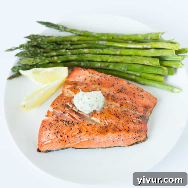 Golden Seared Salmon with Fresh Dill Butter 3 Close-up of pan-seared salmon with a melting pat of dill and garlic butter, showcasing the exquisite texture and vibrant flavors of this speedy recipe.