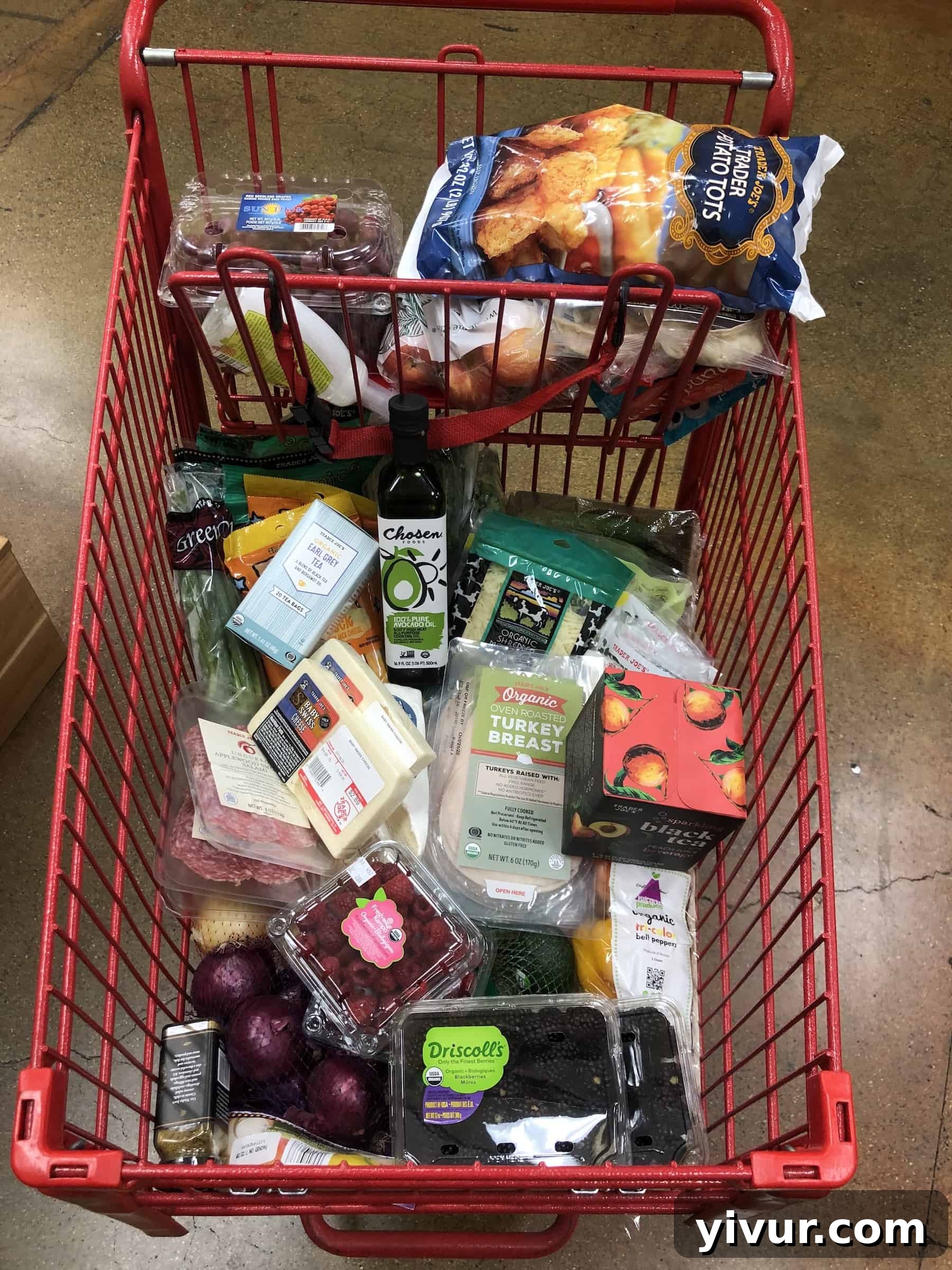 A large photo showcasing a variety of groceries from Trader Joe's, including fresh produce, cheeses, and other keto-friendly items.