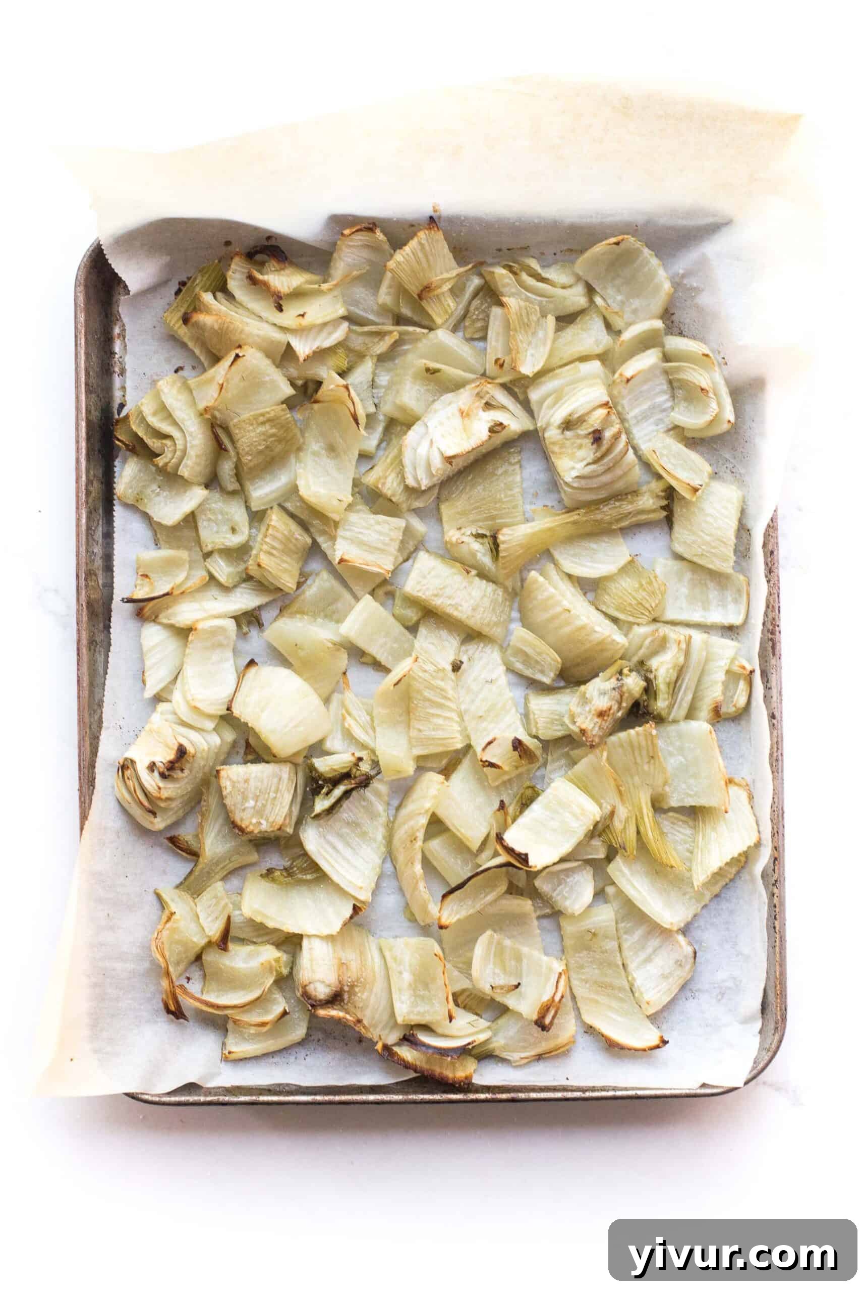 Flavorful Roasted Fennel for Whole30 and Keto 2 Golden-brown roasted fennel slices on a baking sheet, ready to serve.