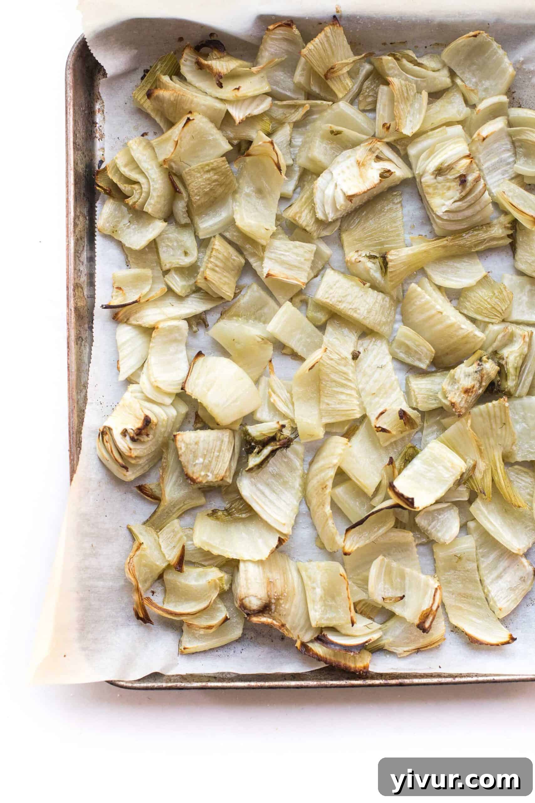 Flavorful Roasted Fennel for Whole30 and Keto 3 Close-up of perfectly roasted fennel pieces on a sheet pan, showing their tender texture and golden edges.