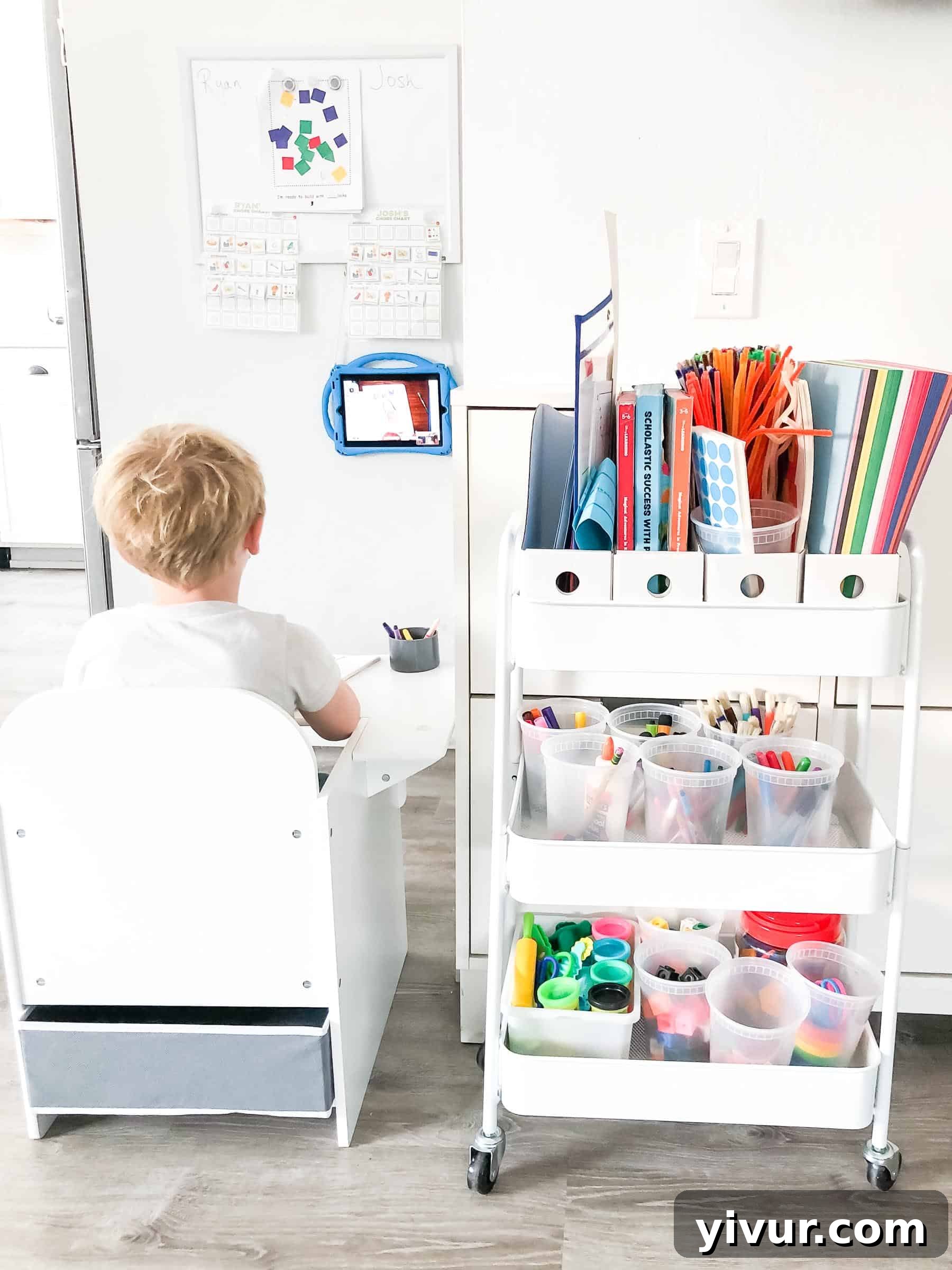 Our Virtual Learning Hub 3 Detailed view of the kindergarten virtual learning setup featuring a child's desk, whiteboard, and organized art cart