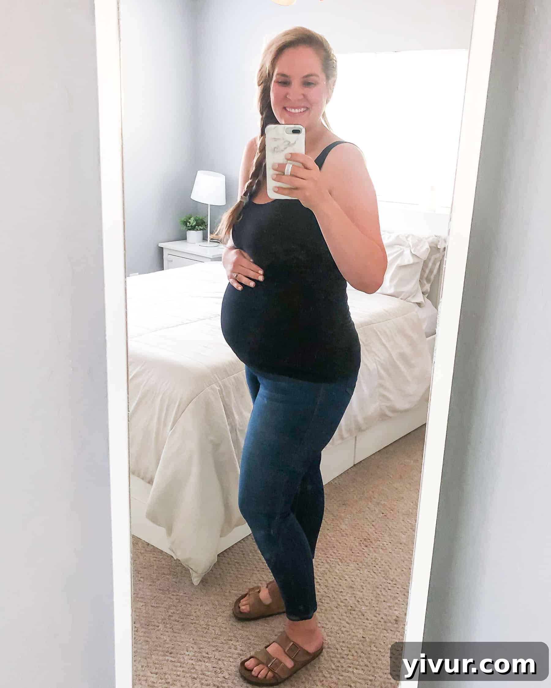 Mama's Must-Haves 2 Pregnant woman showing her baby bump, smiling comfortably