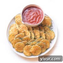 Crispy parmesan zucchini bites appetizer with marinara sauce