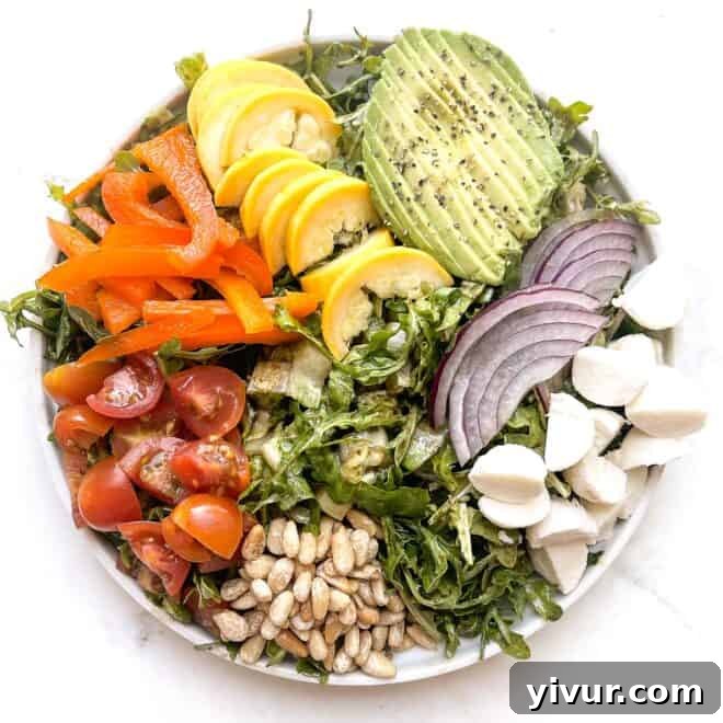 A bowl of fresh Keto Italian Chopped Salad with various vegetables and cheese.