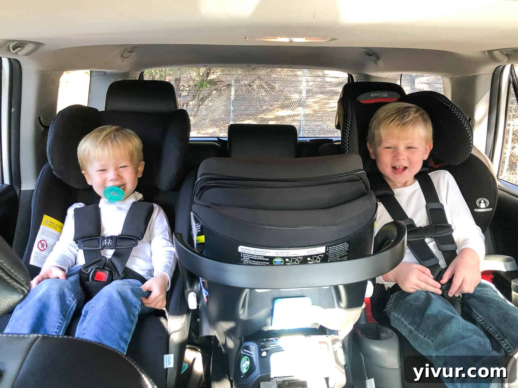 3 car seats across in a row in a 2018 toyota 4runner with 2 toddler boys buckled in