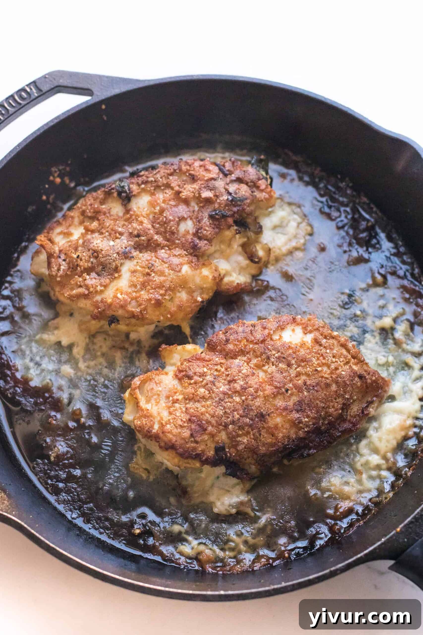 crispy breaded chicken in a cast iron skillet