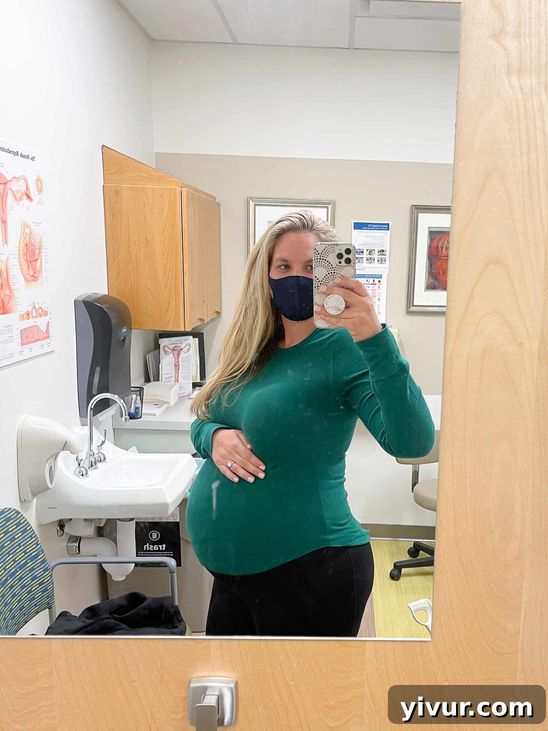 Pregnant woman showing her baby bump during a prenatal check-up