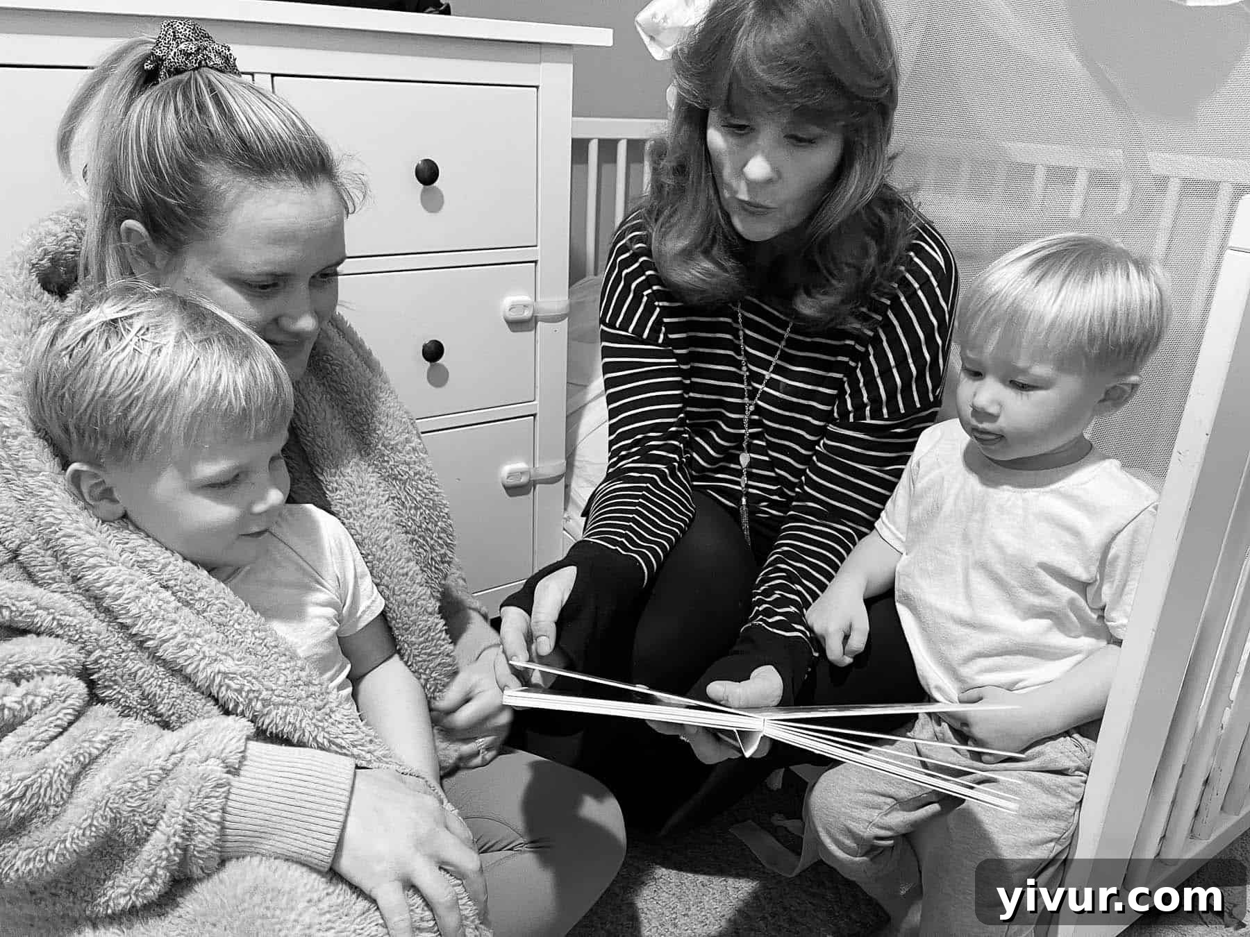Grandma and aunt reading bedtime stories to the boys