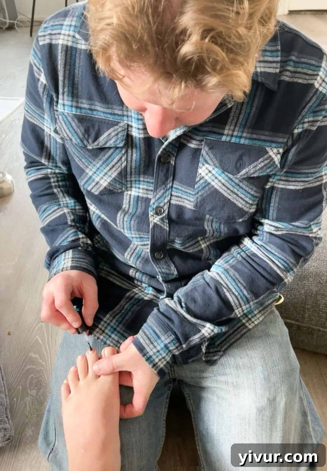 Husband Shawn painting wife's toenails, a loving gesture during late pregnancy, highlighting partner support