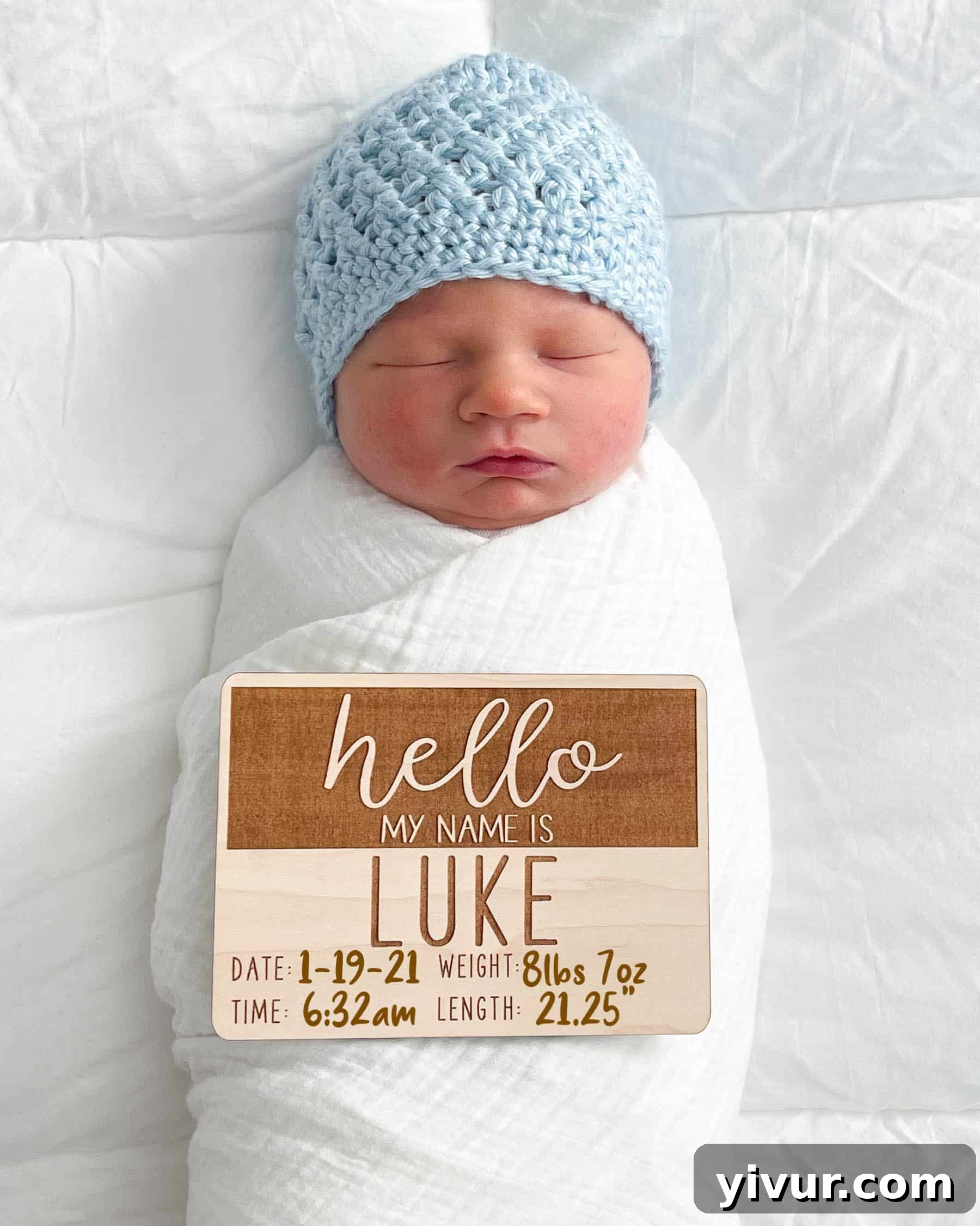 Our newest son, Lucas Shawn, peacefully sleeping, wrapped in a blanket.