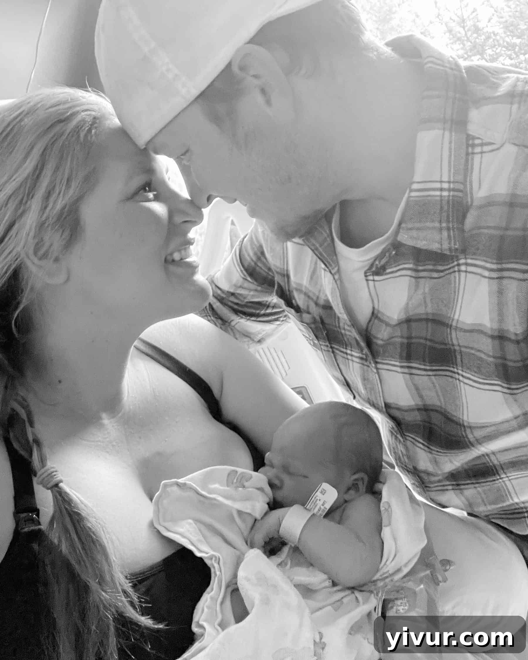Lucas Shawn sleeping peacefully in a soft, white swaddle.