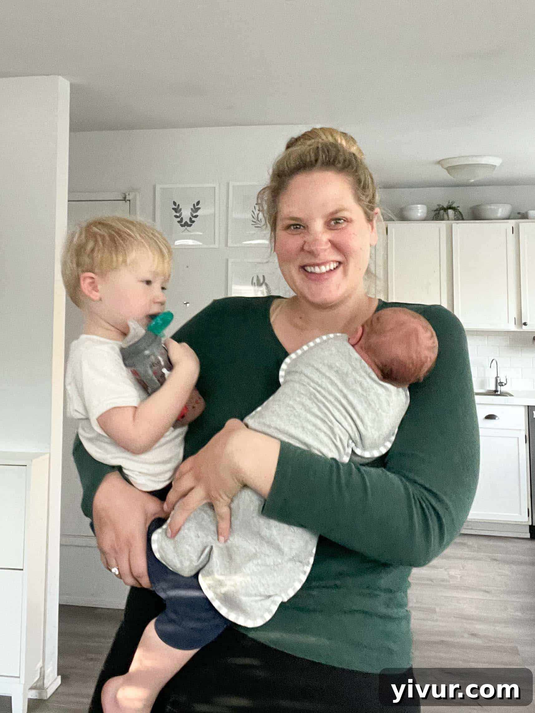 A tender close-up photo of newborn Luke's tiny hand gently gripping an adult's finger, symbolizing new life and family connection.