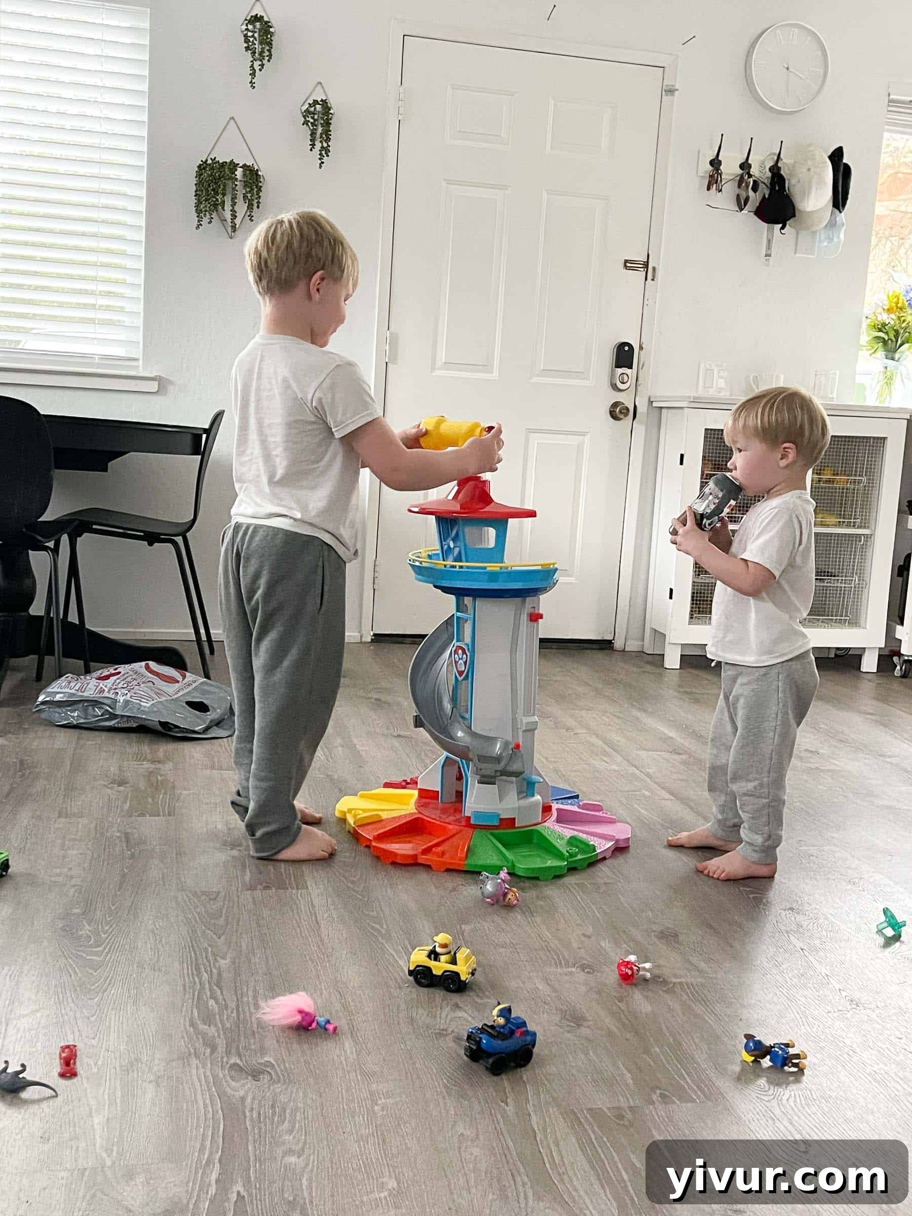A candid shot capturing a joyful family moment, perhaps one of the older boys giggling or interacting with Luke, reflecting happiness and engagement.