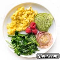A delicious single serving of Keto Soft Scrambled Eggs with Spinach and Marinated Onions, ready to be enjoyed as a quick, healthy breakfast.
