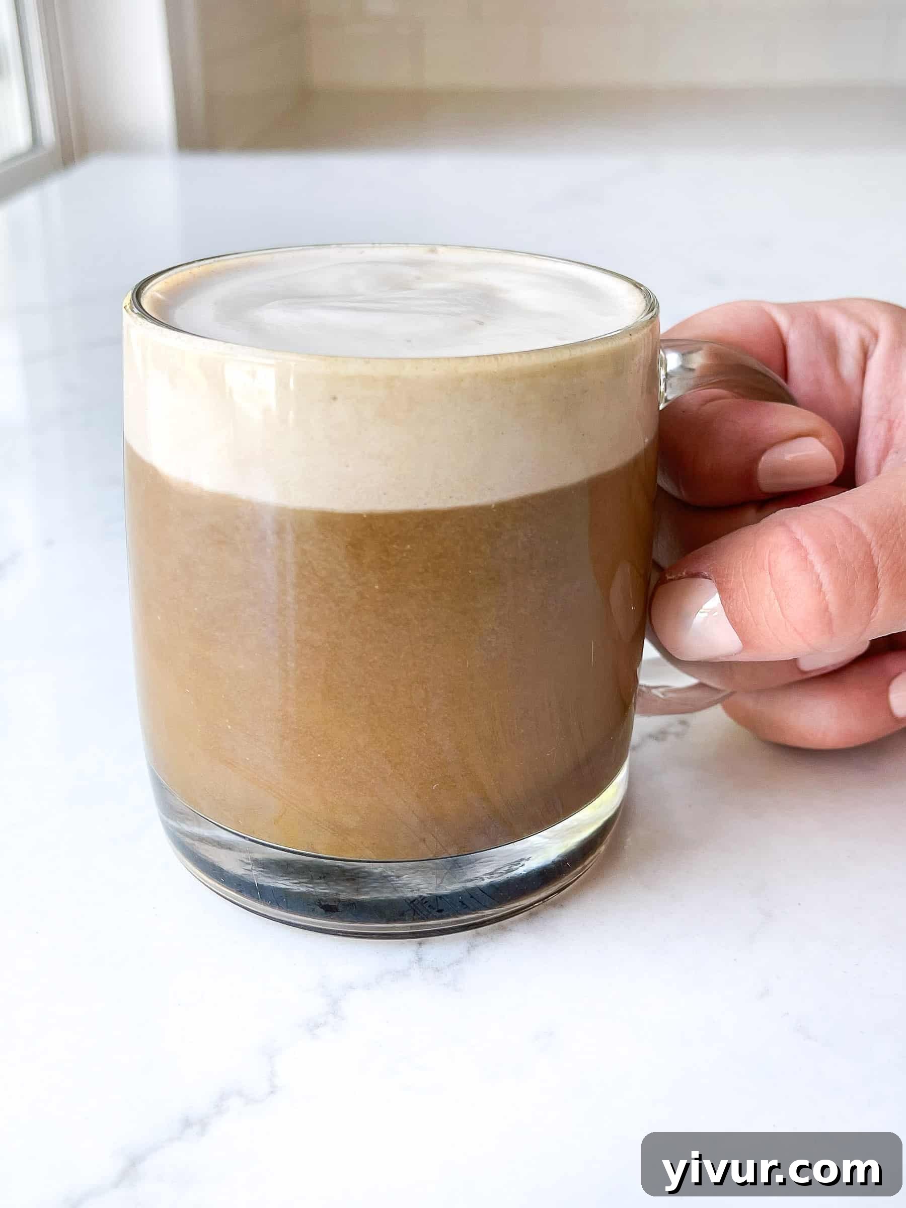 Hand holding a keto superfood latte