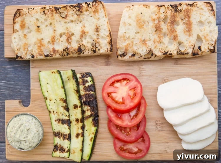 Grilled bread with olive oil, ready to be assembled into a delicious Caprese sandwich.